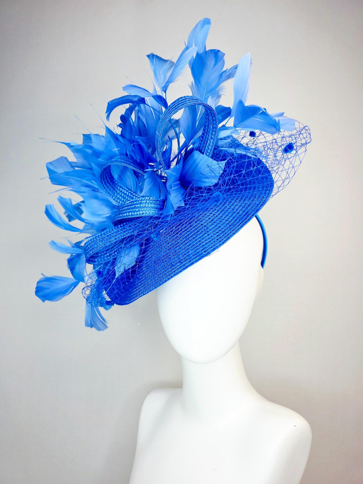 kentucky derby hat fascinator cobalt blue straw saucer with cobalt blue straw bow royal blue feathers and cobalt blue mesh veil