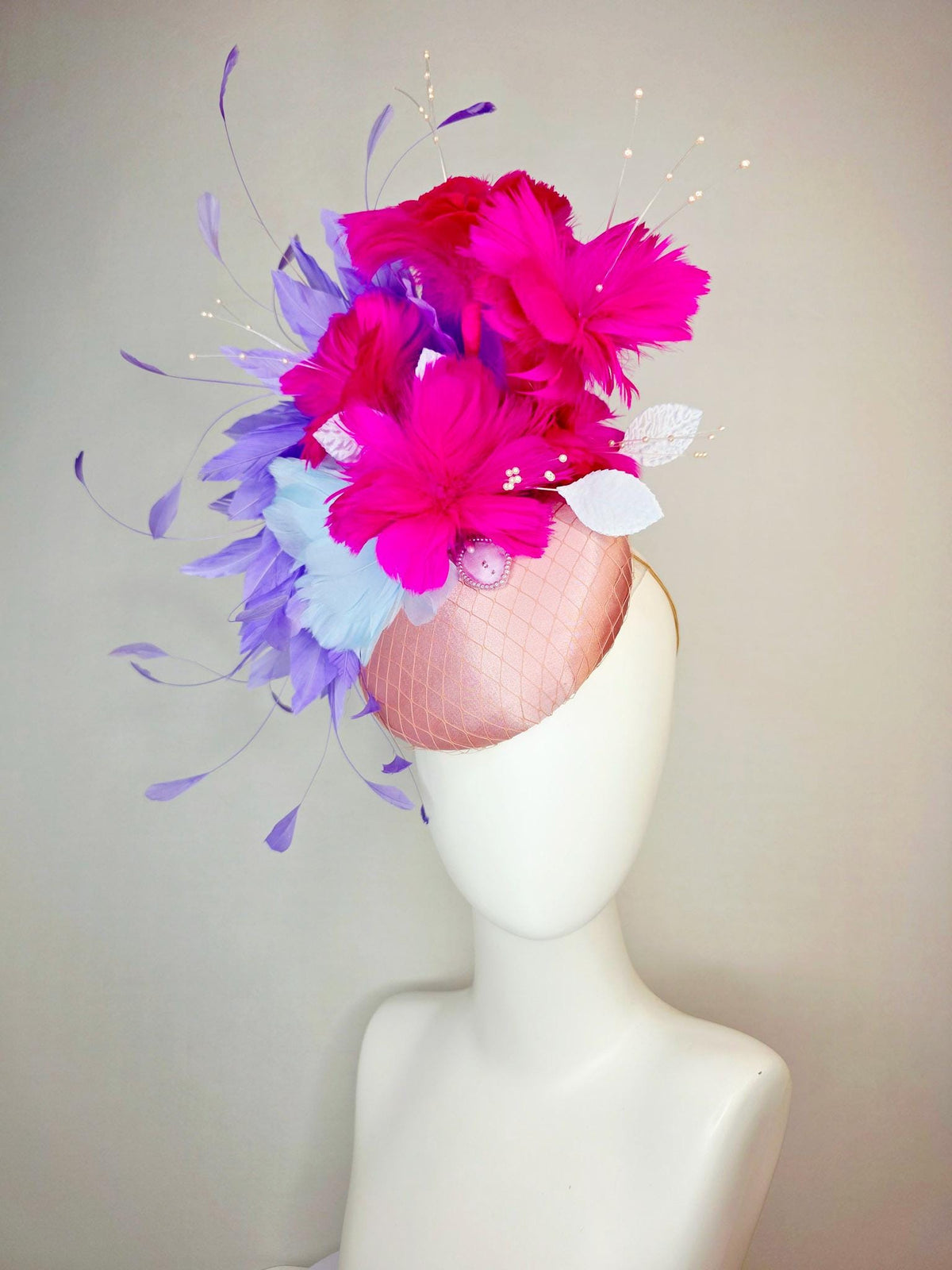 kentucky derby hat fascinator dusty pink satin with netting light blue fuchsia pink feather flowers white leaves lavender purple feathers