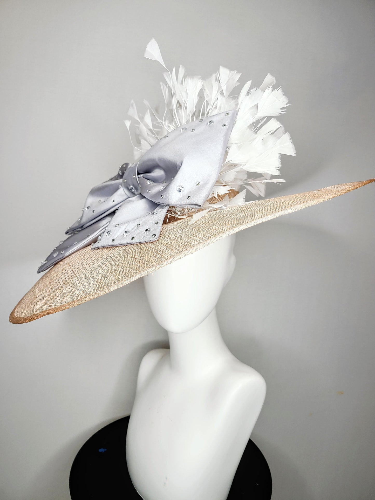 kentucky derby hat wide brim beige taupe sinamay with large satin taffeta silver gray crystal bow with white feathers