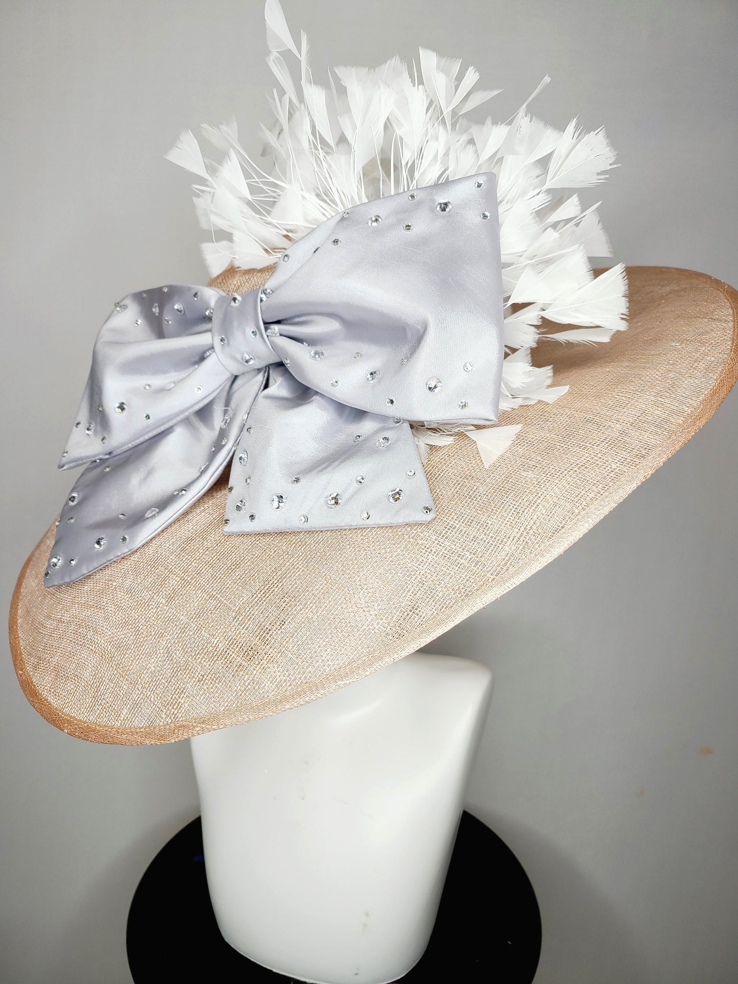 kentucky derby hat wide brim beige taupe sinamay with large satin taffeta silver gray crystal bow with white feathers