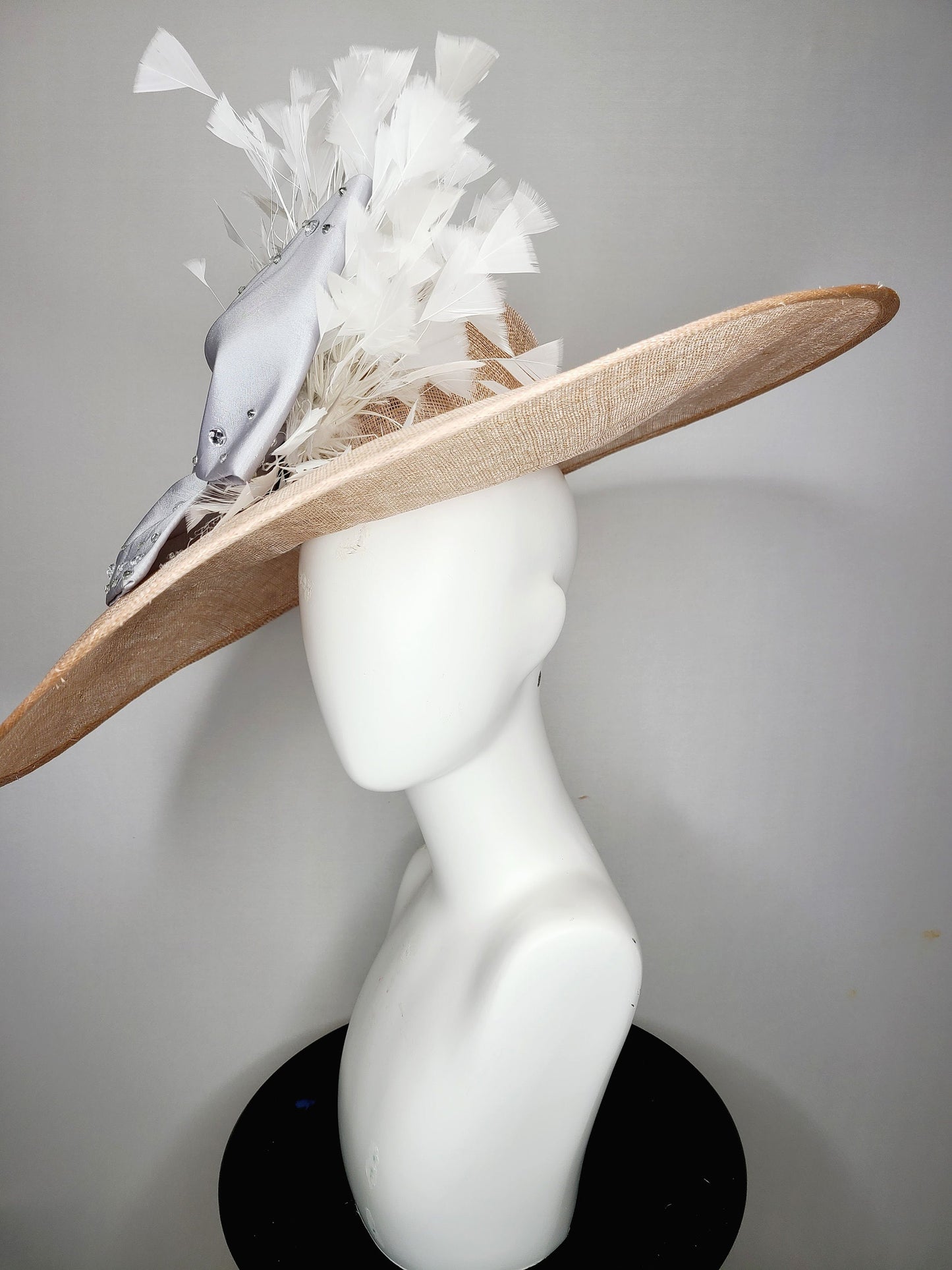 kentucky derby hat wide brim beige taupe sinamay with large satin taffeta silver gray crystal bow with white feathers