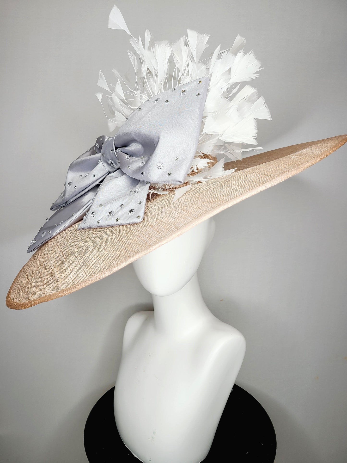 kentucky derby hat wide brim beige taupe sinamay with large satin taffeta silver gray crystal bow with white feathers