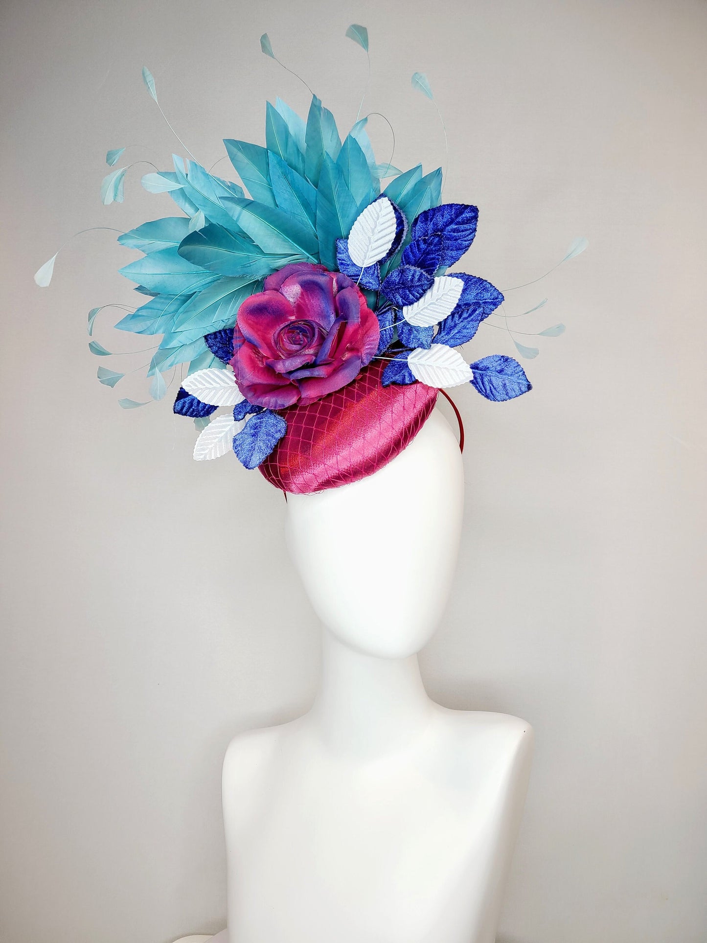 kentucky derby hat fascinator fuchsia magenta satin with painted magenta blue rose with teal blue feathers light blue royal blue leaves