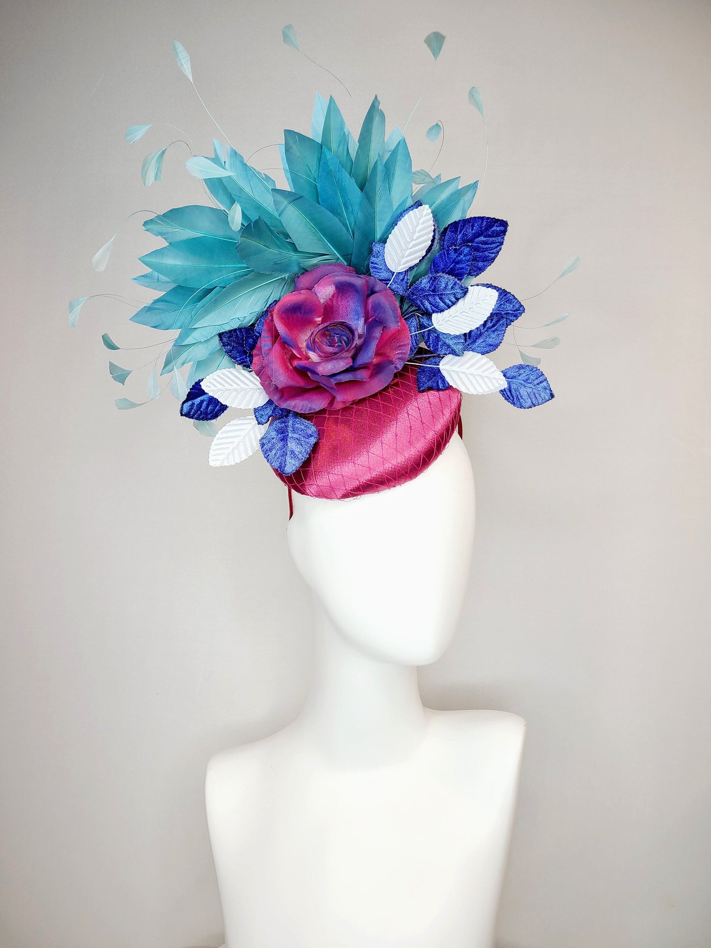 kentucky derby hat fascinator fuchsia magenta satin with painted magenta blue rose with teal blue feathers light blue royal blue leaves