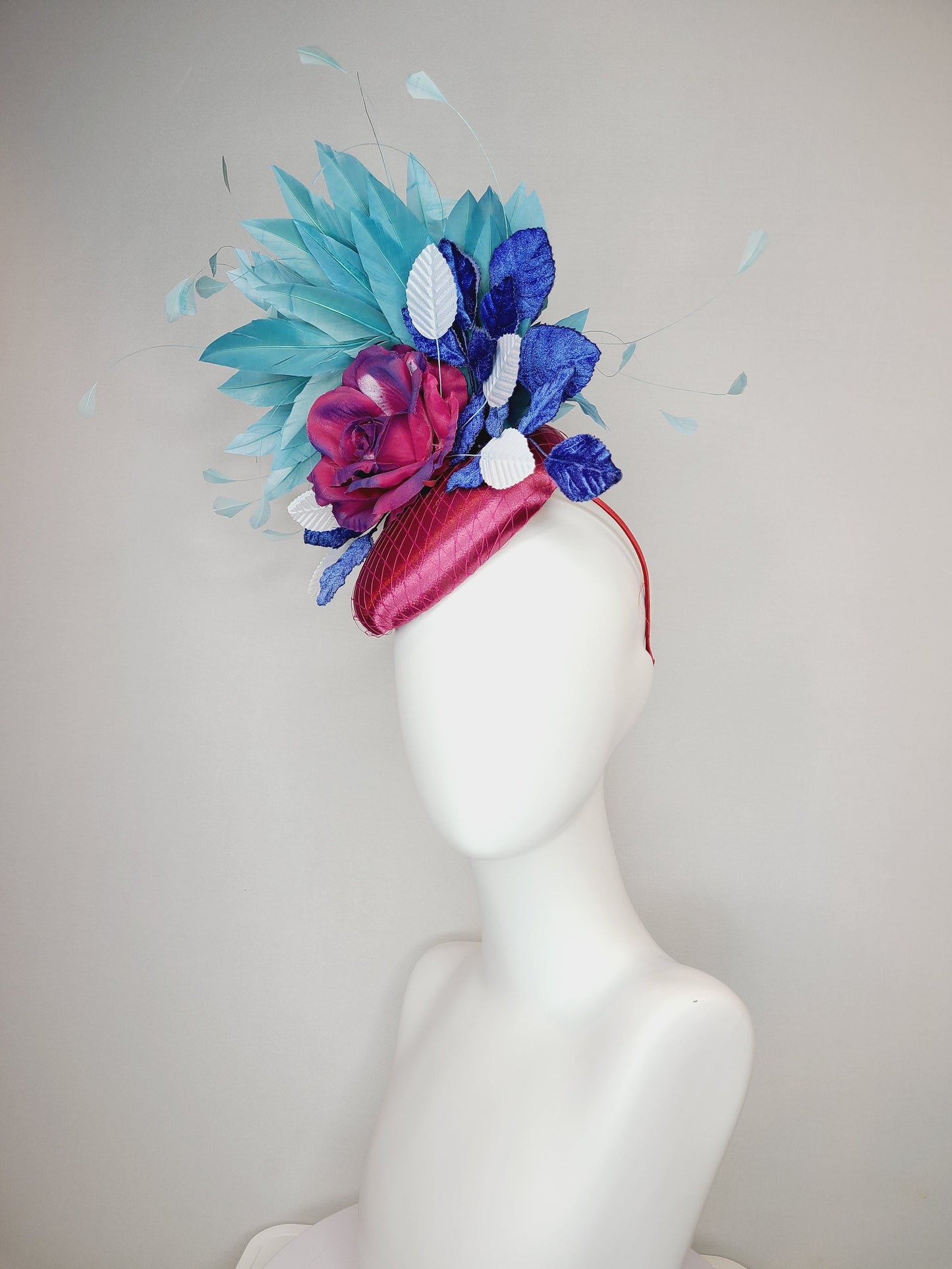 kentucky derby hat fascinator fuchsia magenta satin with painted magenta blue rose with teal blue feathers light blue royal blue leaves