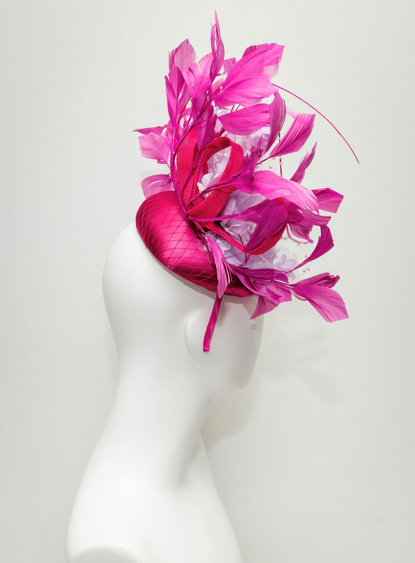 kentucky derby hat fascinator magenta fuchsia hot pink satin with bright pink feathers lavender light purple satin flowers pearls leaves