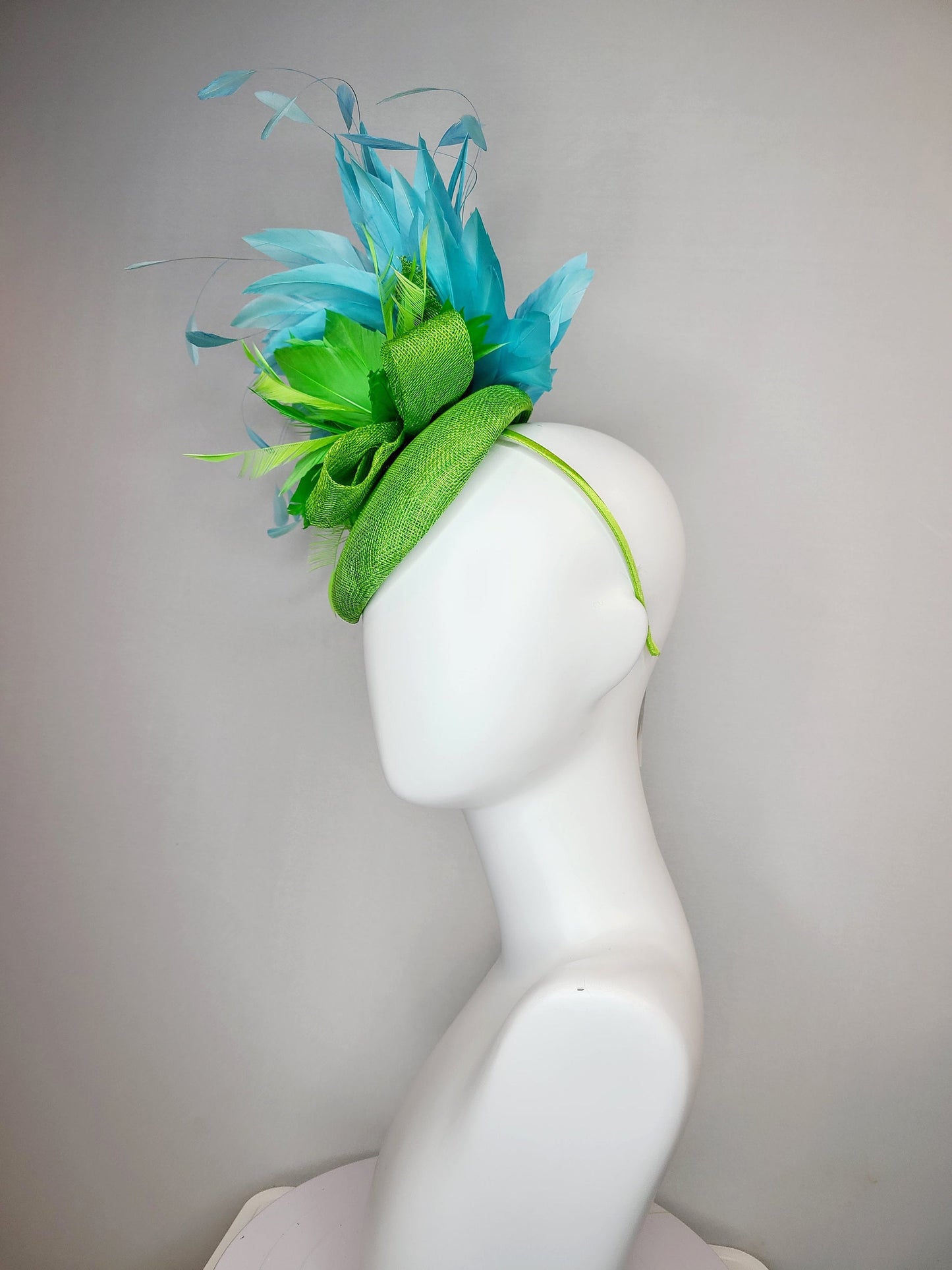 kentucky derby hat fascinator bright apple green sinamay with sinamay and feather flower and large light blue aqua feathers