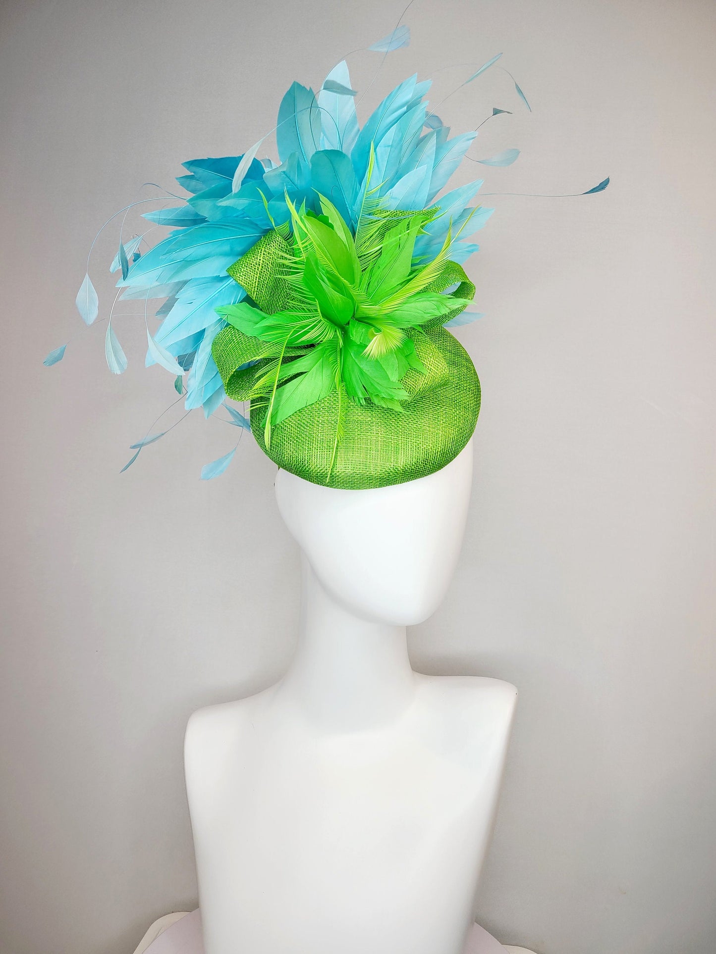 kentucky derby hat fascinator bright apple green sinamay with sinamay and feather flower and large light blue aqua feathers