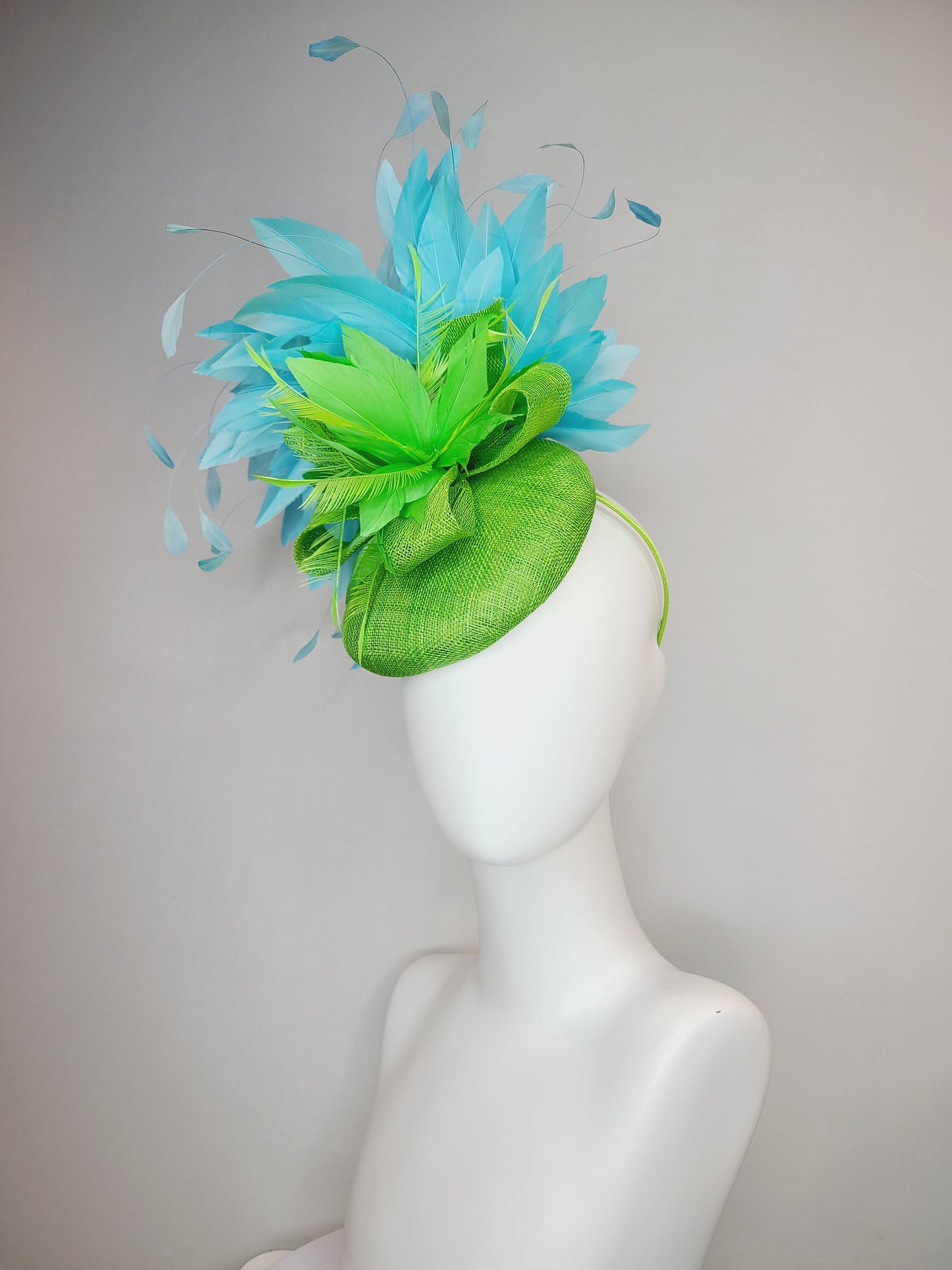 kentucky derby hat fascinator bright apple green sinamay with sinamay and feather flower and large light blue aqua feathers