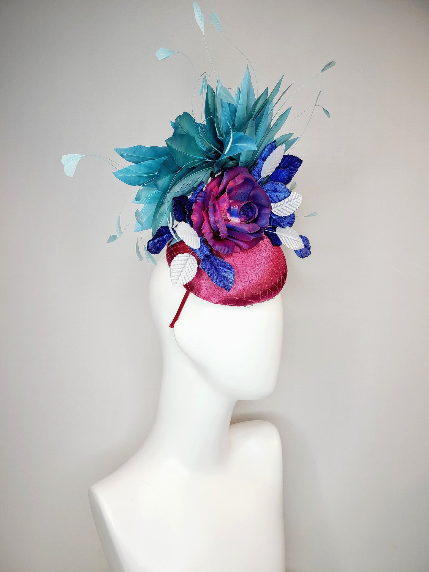 kentucky derby hat fascinator fuchsia magenta satin with painted magenta blue rose with teal blue feathers light blue royal blue leaves