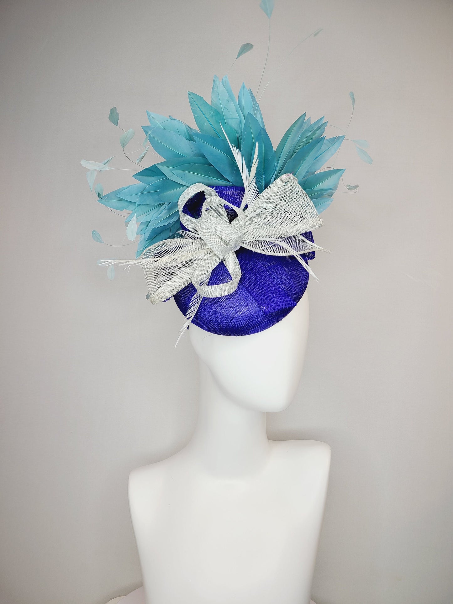 kentucky derby hat fascinator sinamay royal blue base with teal peacock blue  feathers with very light gray silver sinamay bow