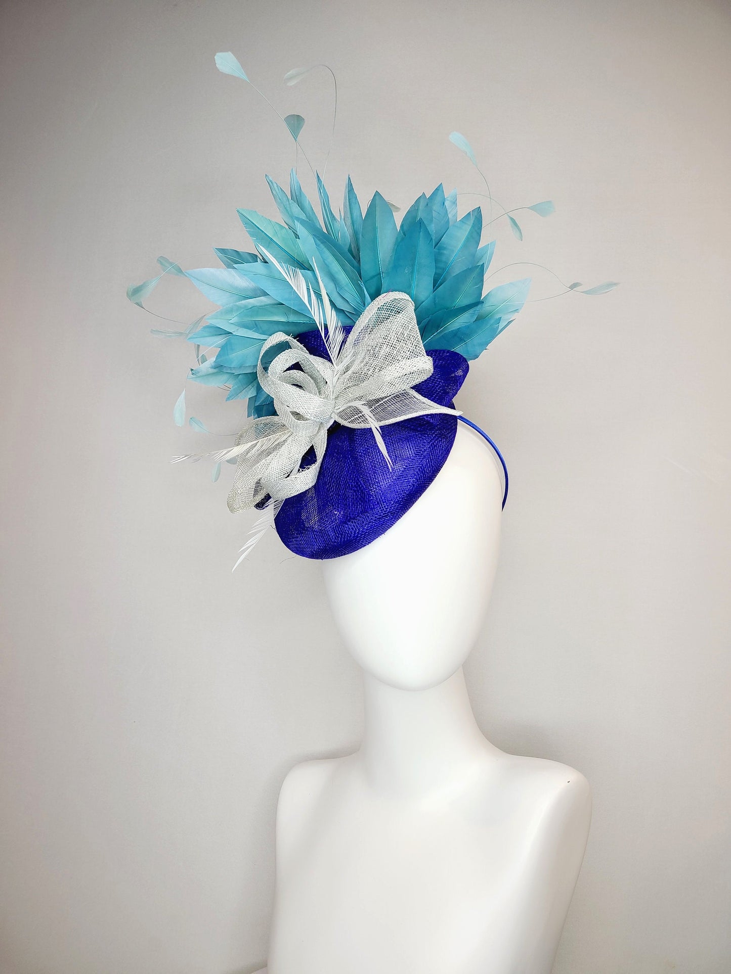 kentucky derby hat fascinator sinamay royal blue base with teal peacock blue  feathers with very light gray silver sinamay bow