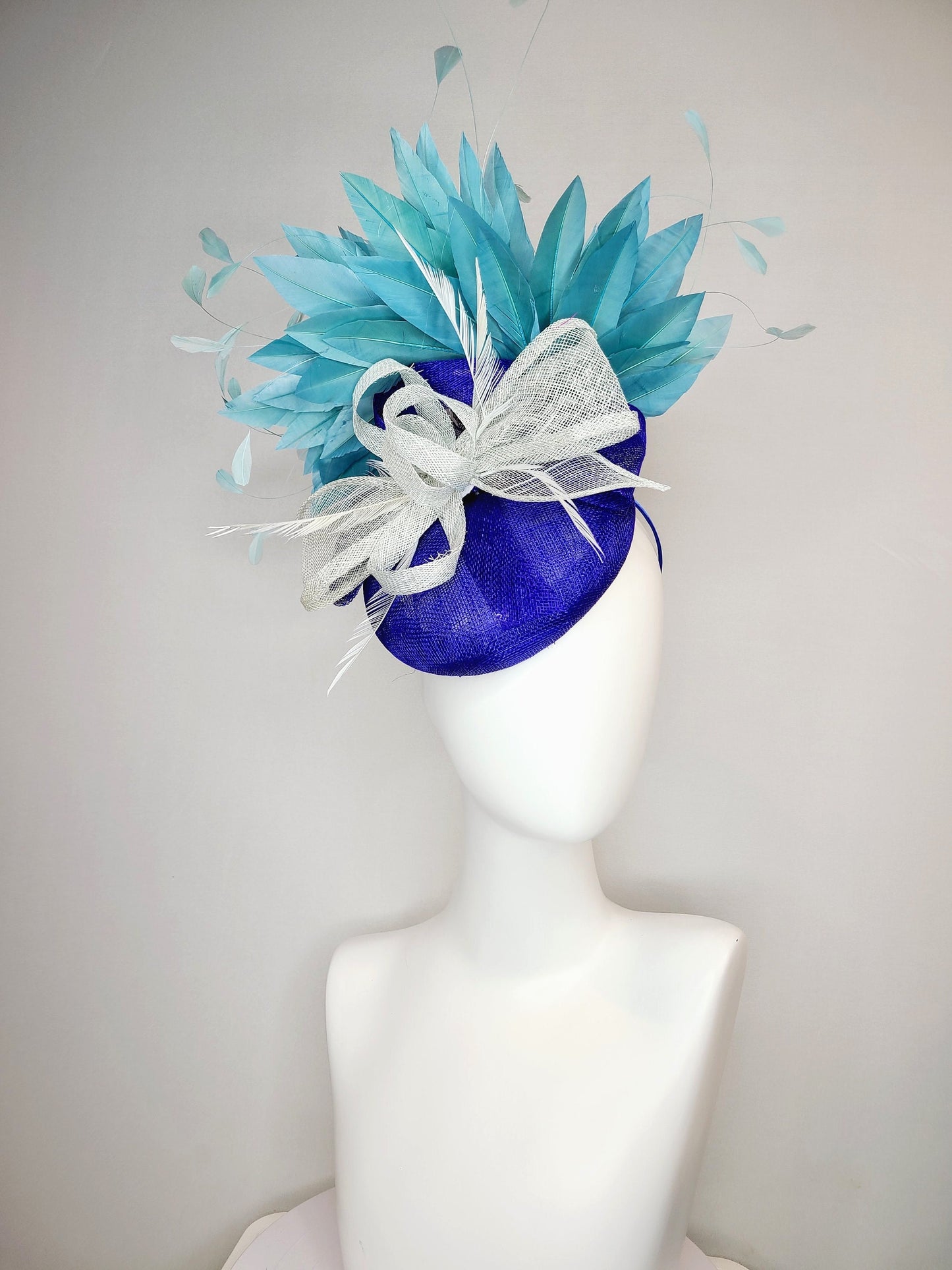 kentucky derby hat fascinator sinamay royal blue base with teal peacock blue  feathers with very light gray silver sinamay bow