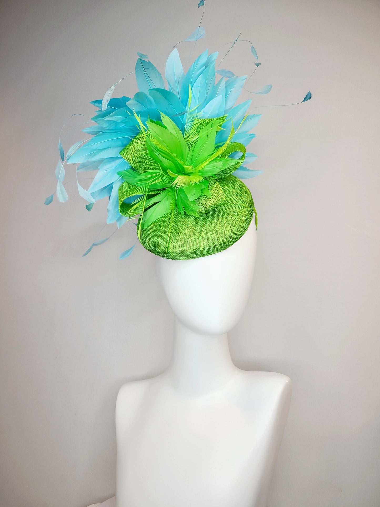 kentucky derby hat fascinator bright apple green sinamay with sinamay and feather flower and large light blue aqua feathers