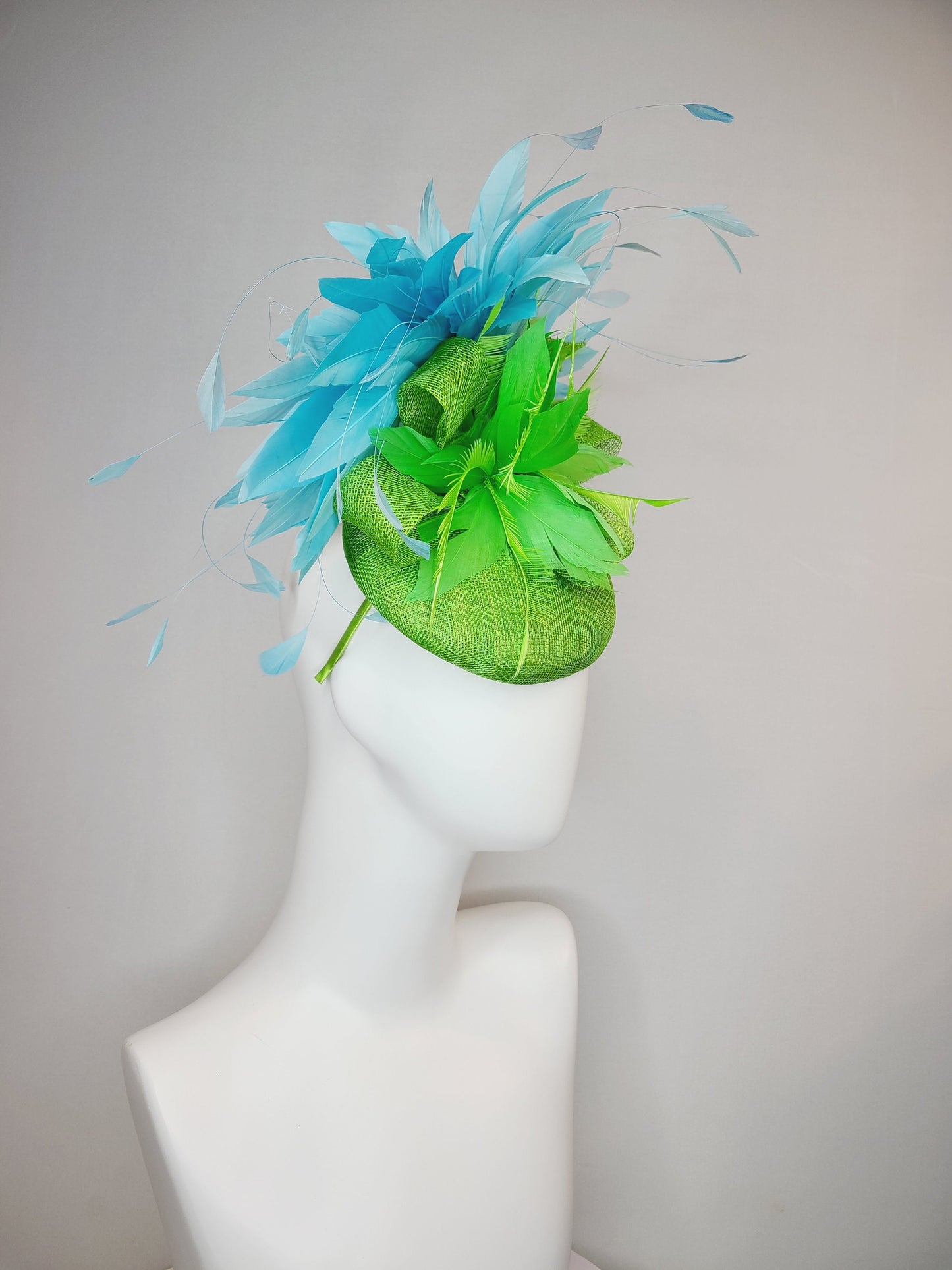 kentucky derby hat fascinator bright apple green sinamay with sinamay and feather flower and large light blue aqua feathers