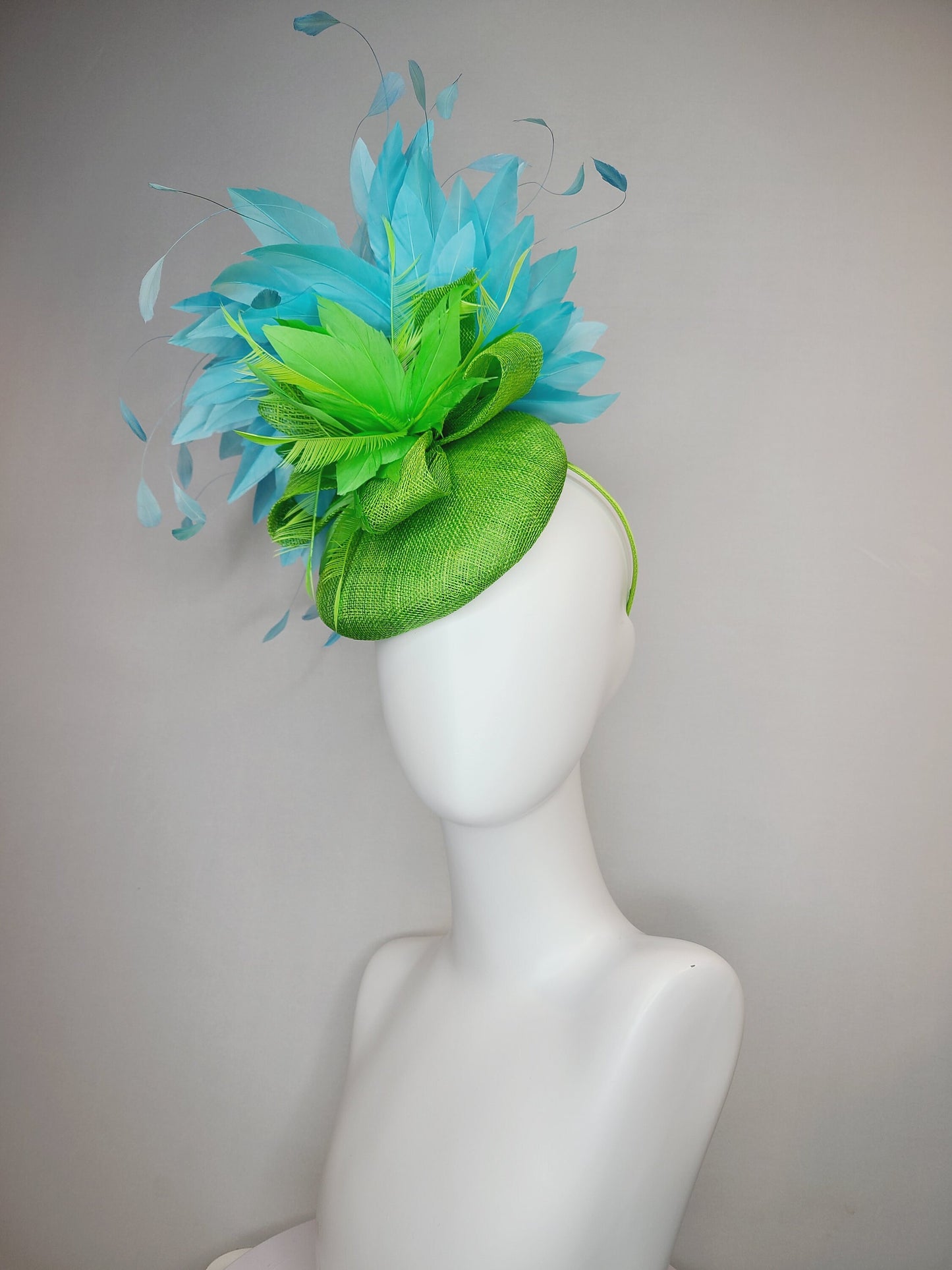 kentucky derby hat fascinator bright apple green sinamay with sinamay and feather flower and large light blue aqua feathers