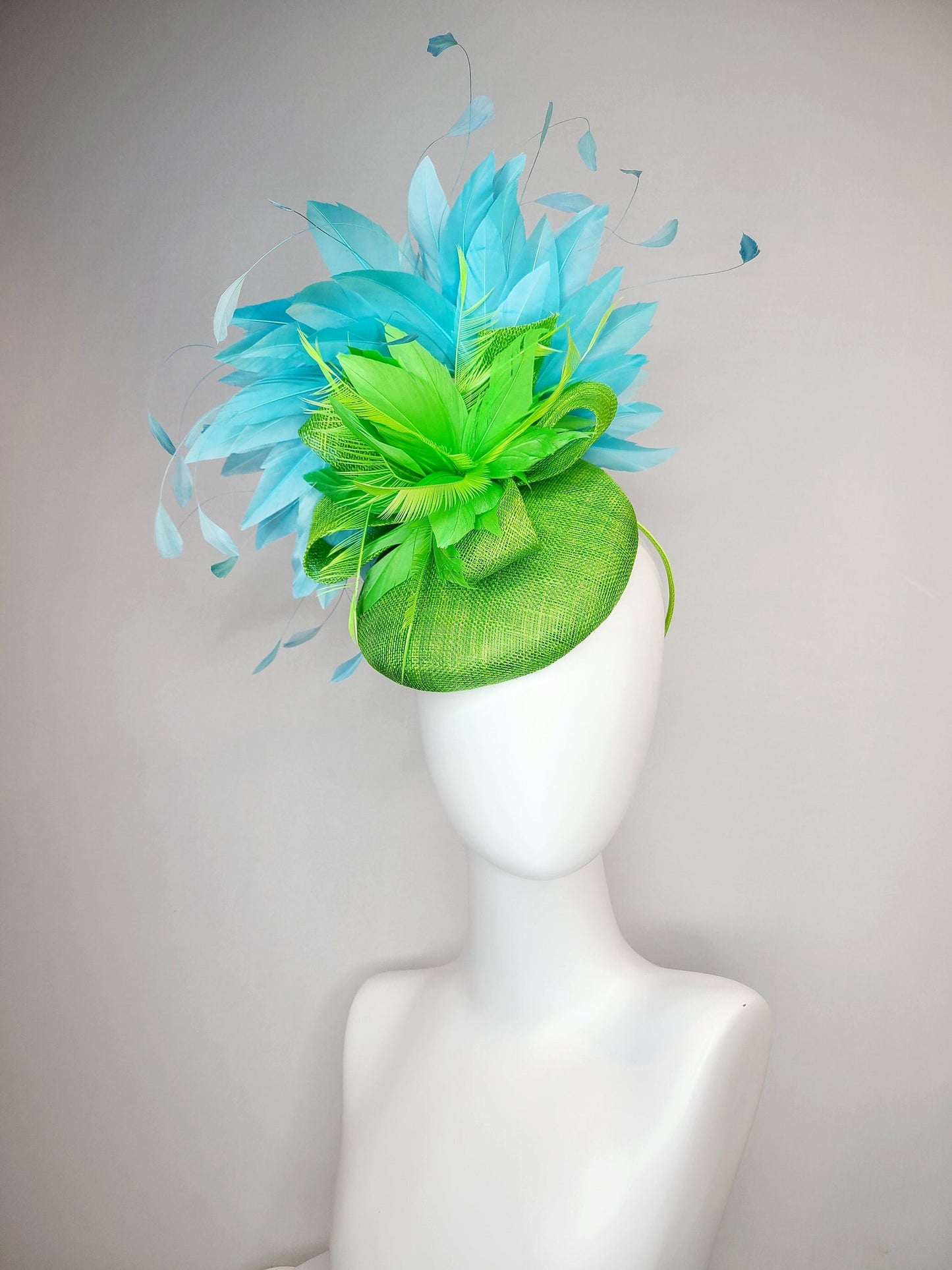 kentucky derby hat fascinator bright apple green sinamay with sinamay and feather flower and large light blue aqua feathers