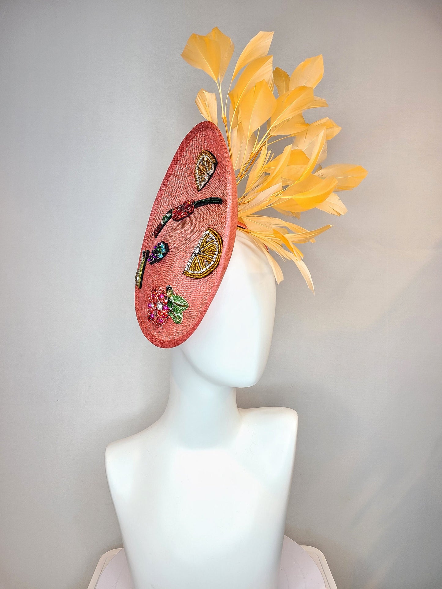 kentucky derby hat fascinator coral sinamay saucer with orange feathers with crystal rhinestone fruit grapes cherry lemon