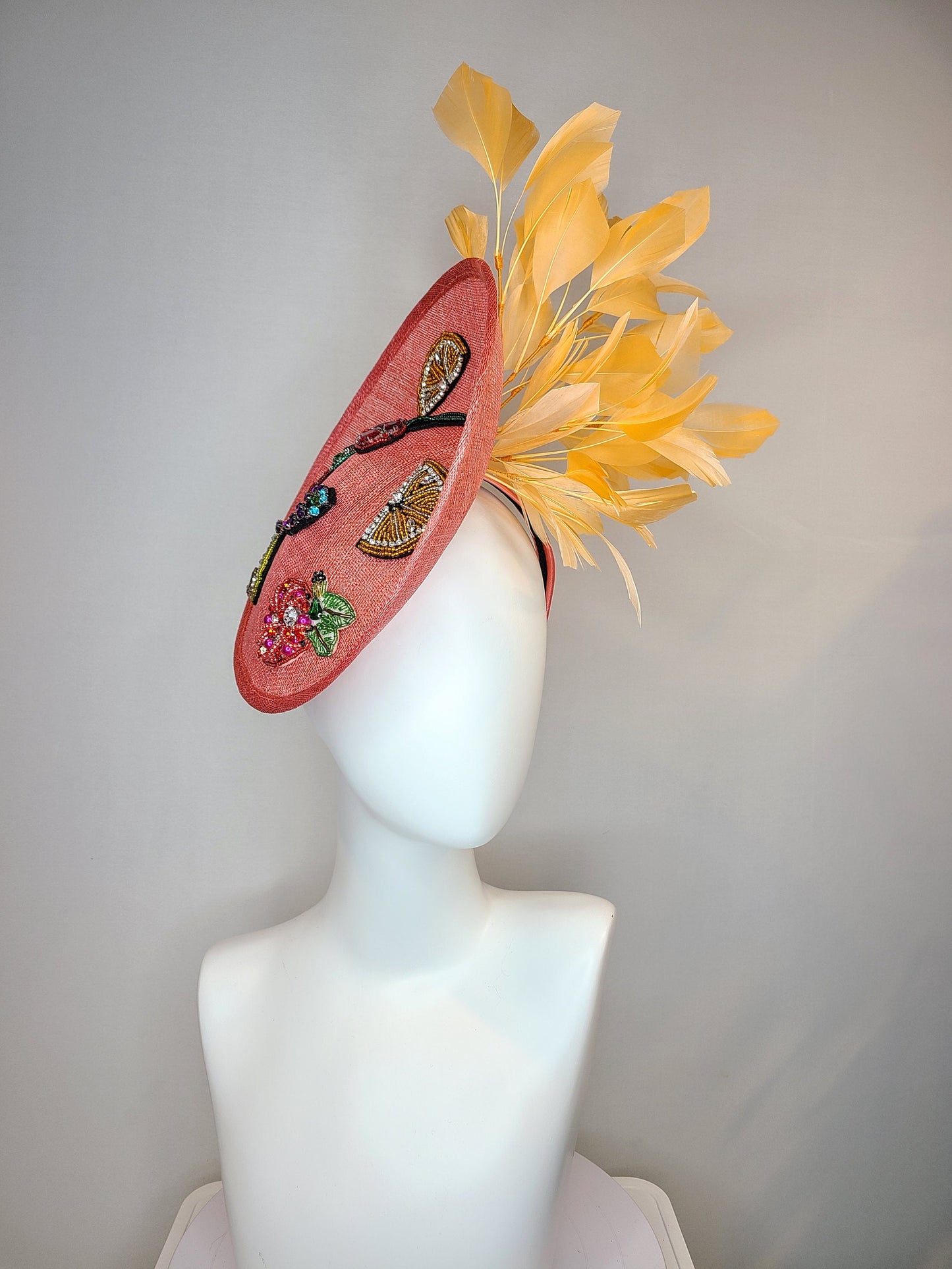 kentucky derby hat fascinator coral sinamay saucer with orange feathers with crystal rhinestone fruit grapes cherry lemon