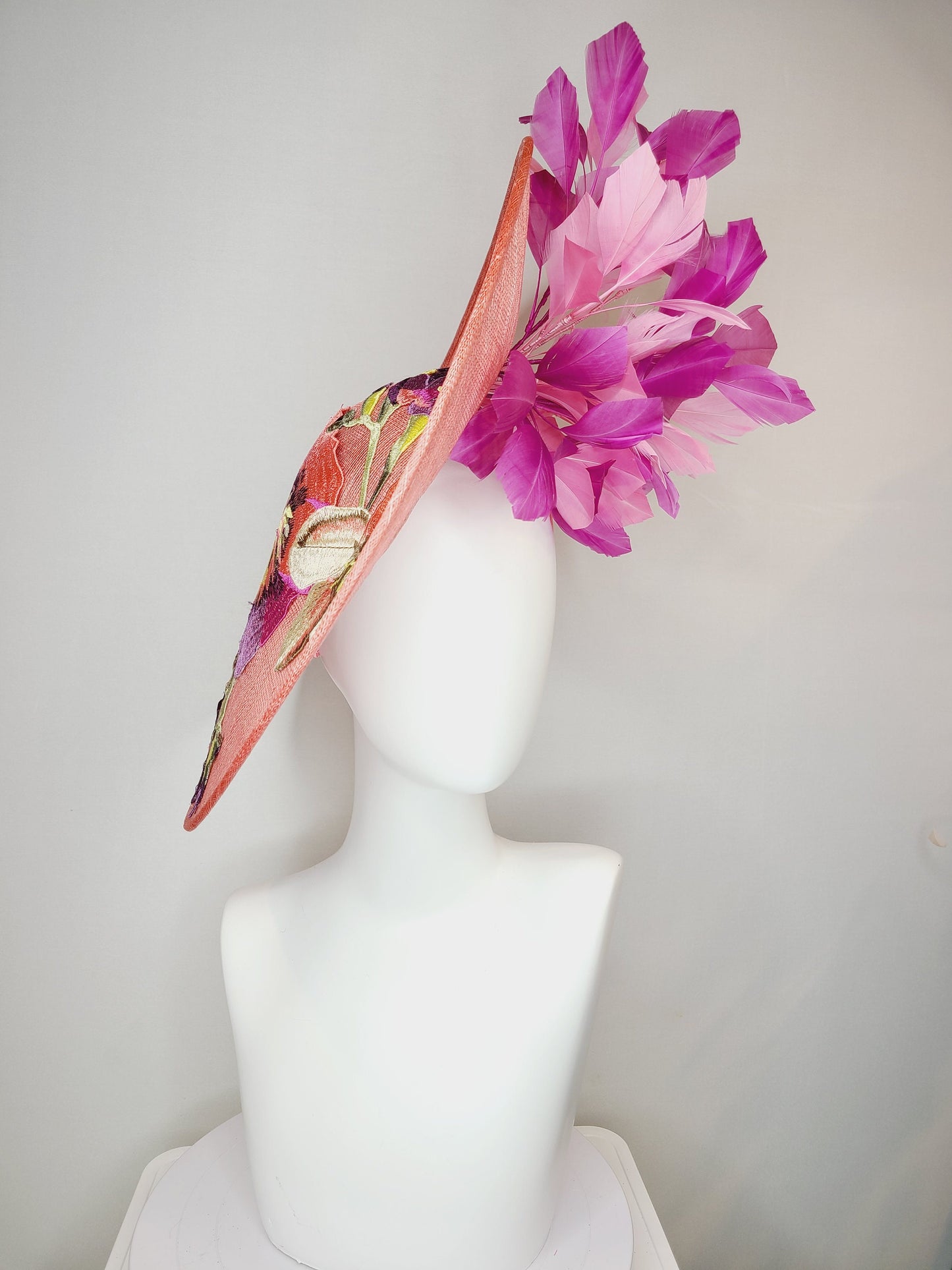 kentucky derby hat fascinator coral pink peach sinamay saucer fascinator with embroidered pink purple gold flowers with pink purple feathers