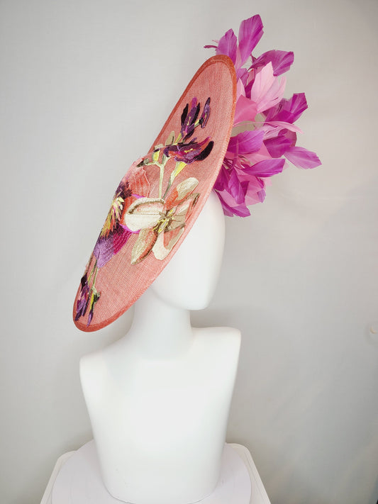 kentucky derby hat fascinator coral pink peach sinamay saucer fascinator with embroidered pink purple gold flowers with pink purple feathers