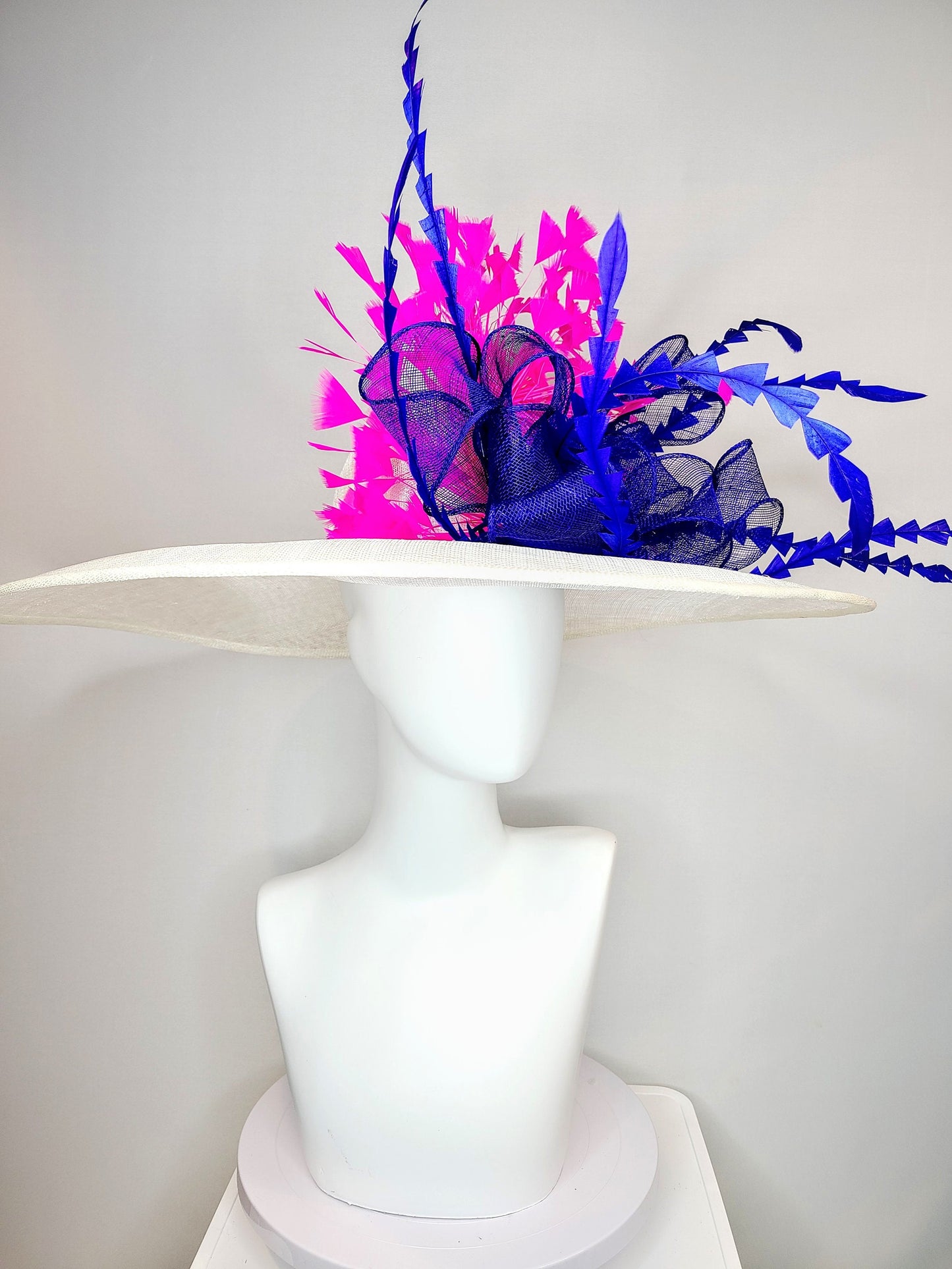 kentucky derby hat wide brim white sinamay with royal blue sinamay bow and hot pink fuchsia feathers