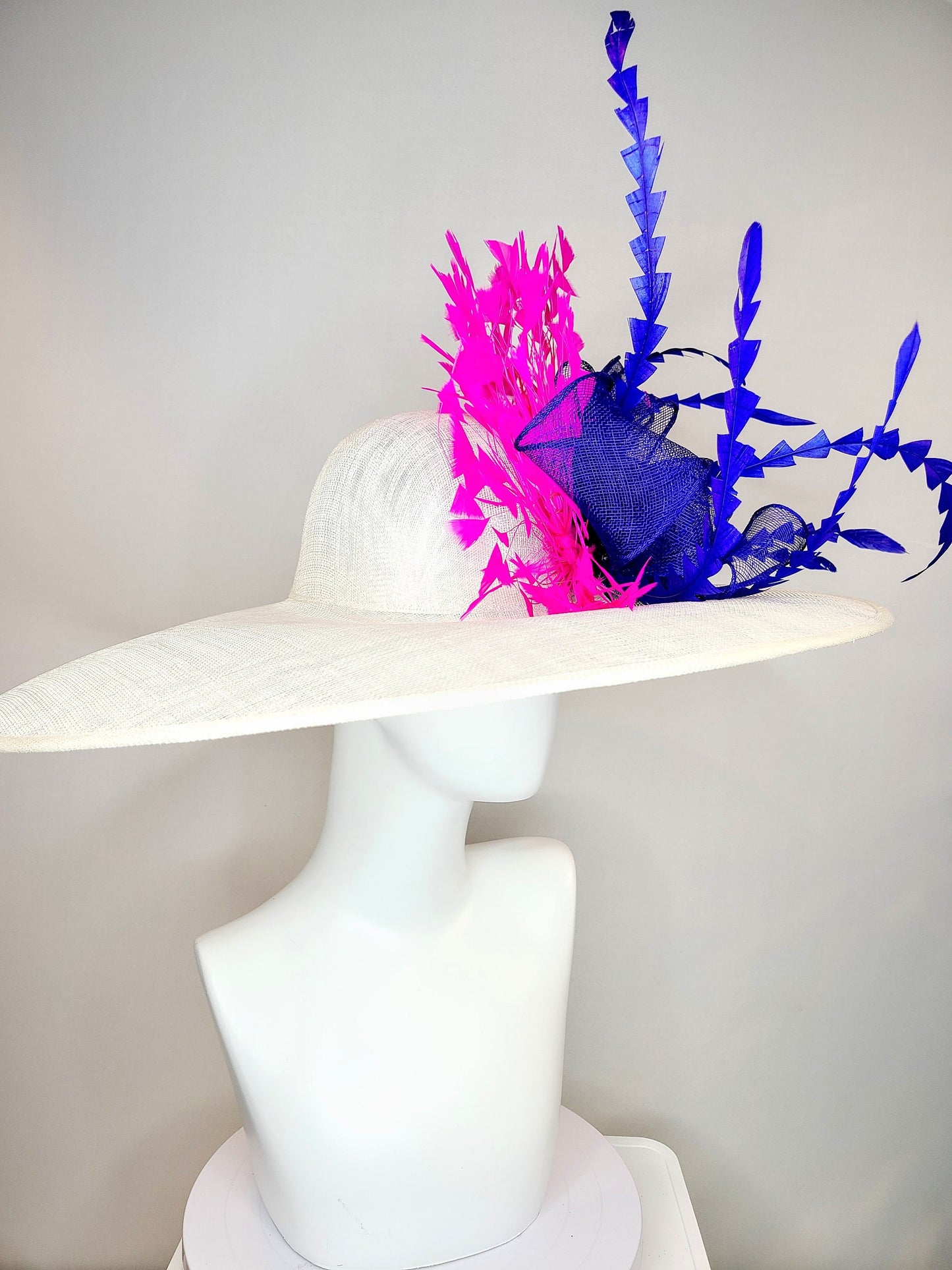 kentucky derby hat wide brim white sinamay with royal blue sinamay bow and hot pink fuchsia feathers