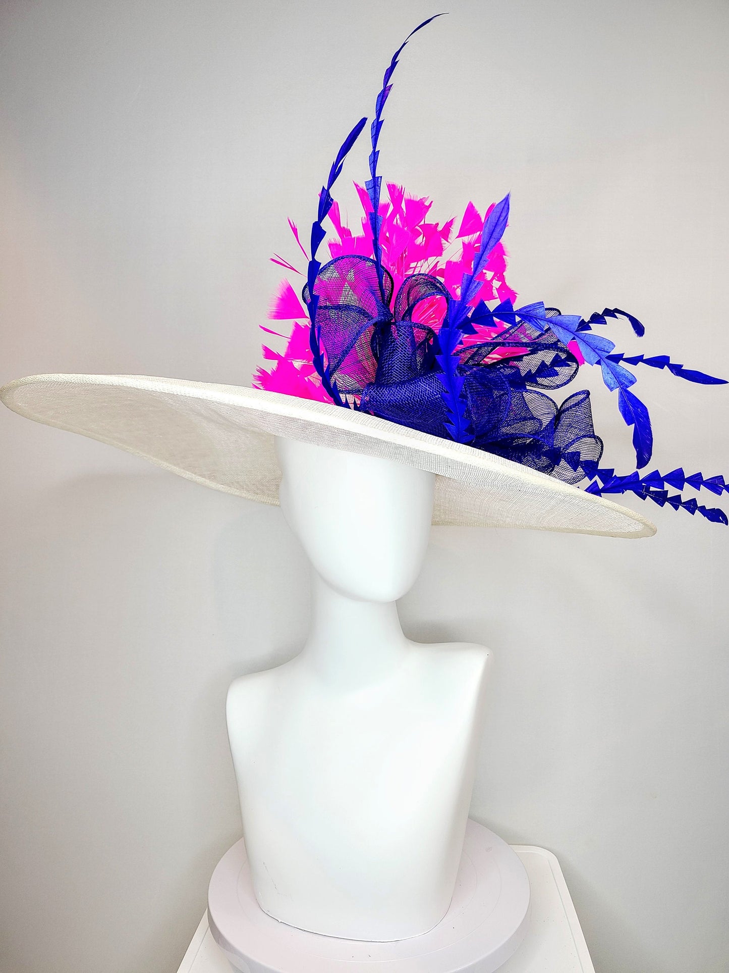 kentucky derby hat wide brim white sinamay with royal blue sinamay bow and hot pink fuchsia feathers