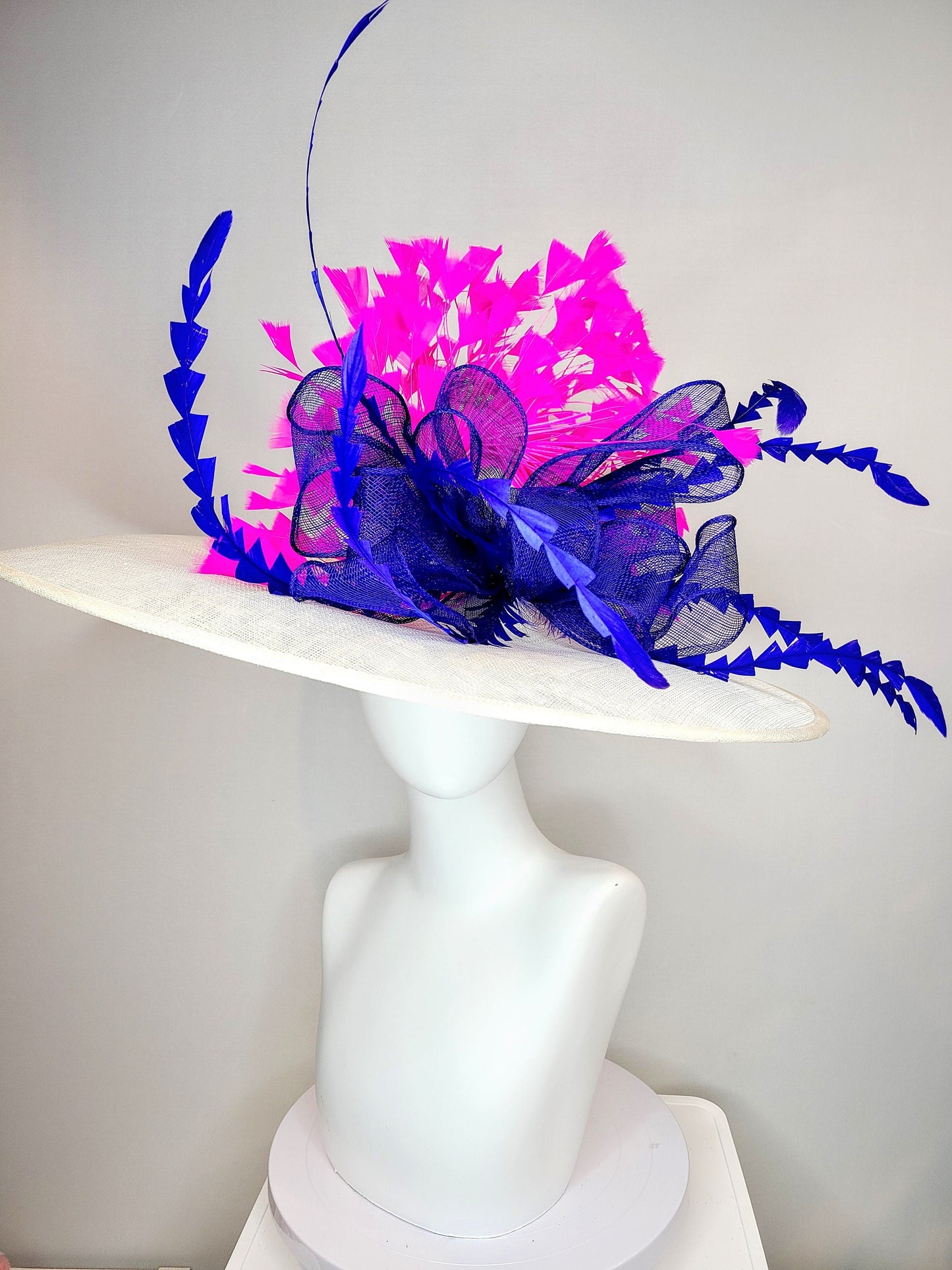 kentucky derby hat wide brim white sinamay with royal blue sinamay bow and hot pink fuchsia feathers