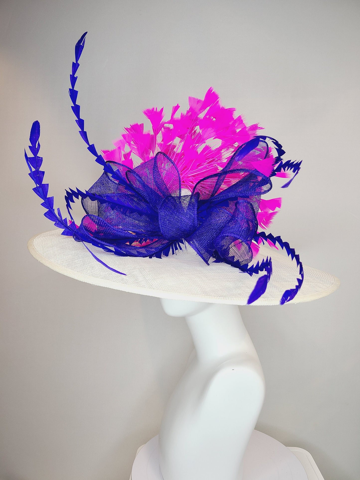 kentucky derby hat wide brim white sinamay with royal blue sinamay bow and hot pink fuchsia feathers