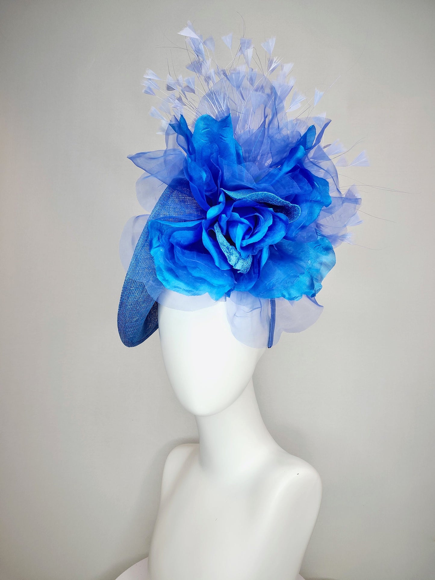 kentucky derby hat fascinator blue sinamay with royal blue large organza flower with periwinkle blue triangle feather spray