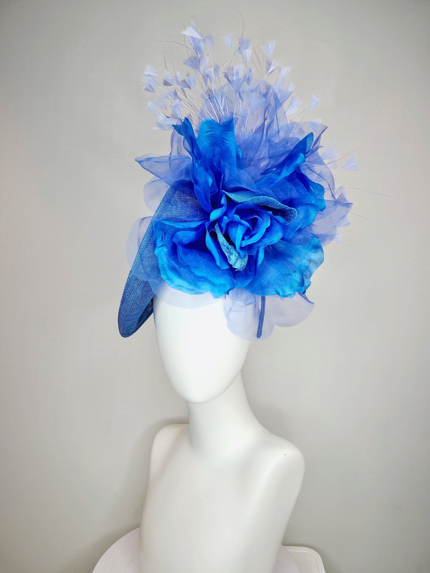 kentucky derby hat fascinator blue sinamay with royal blue large organza flower with periwinkle blue triangle feather spray