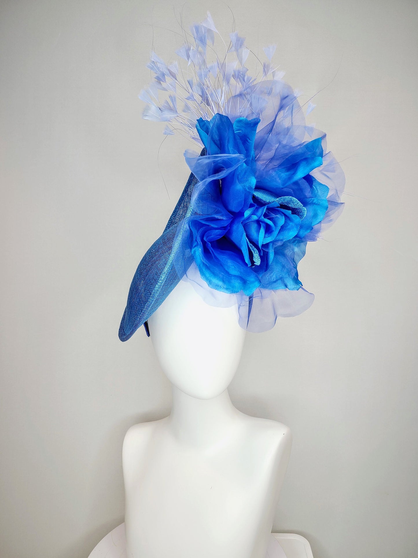 kentucky derby hat fascinator blue sinamay with royal blue large organza flower with periwinkle blue triangle feather spray