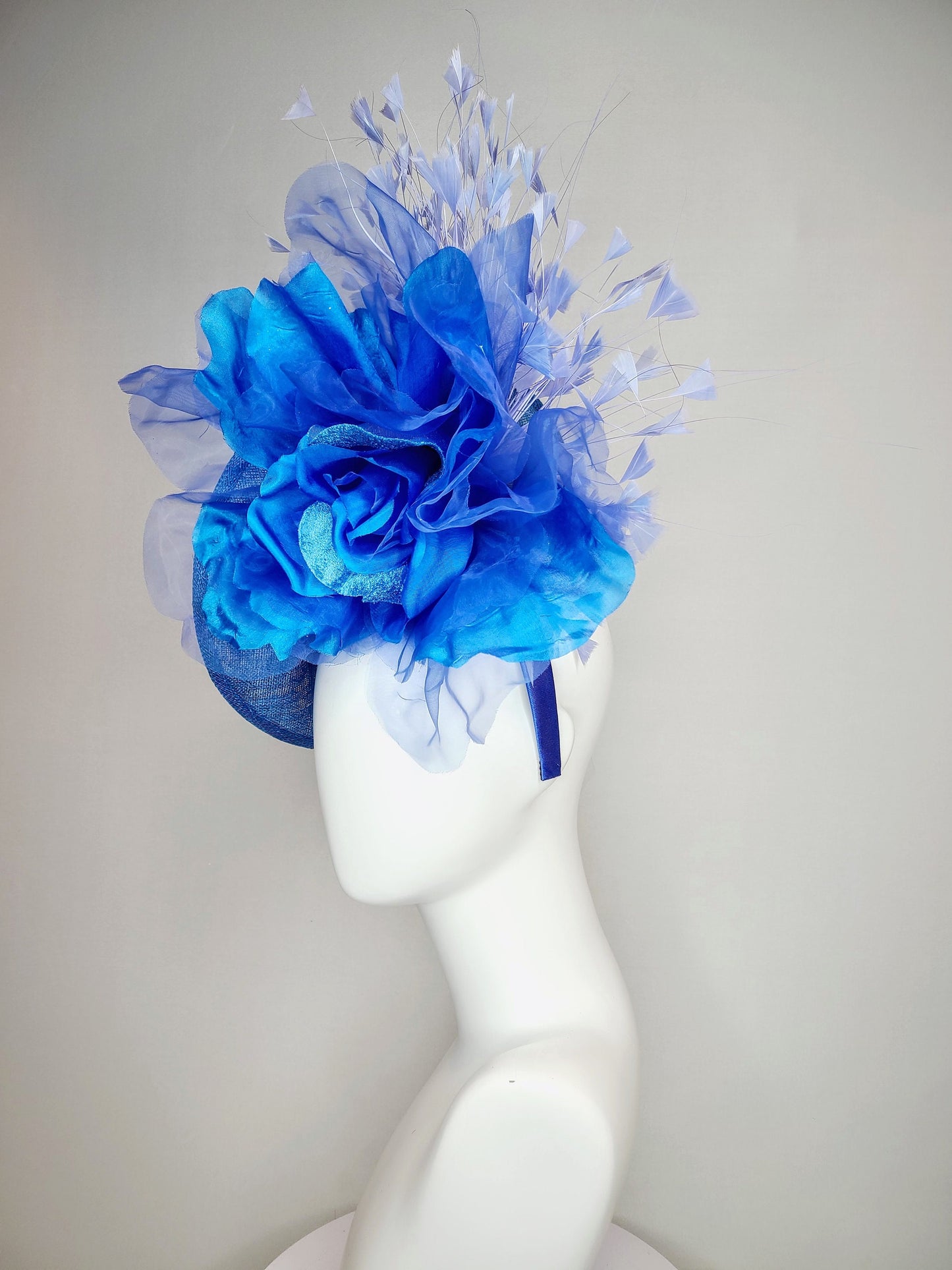 kentucky derby hat fascinator blue sinamay with royal blue large organza flower with periwinkle blue triangle feather spray