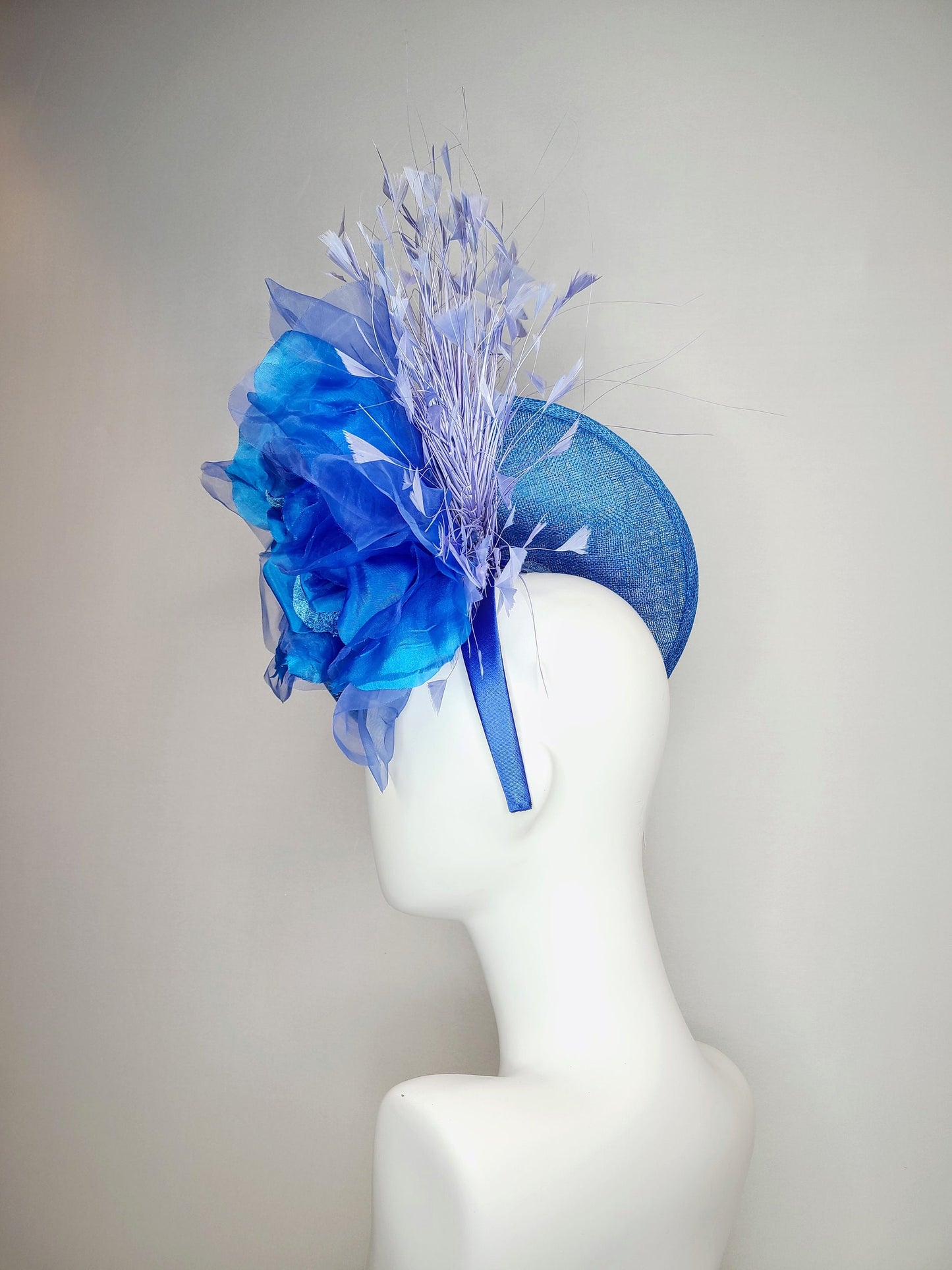 kentucky derby hat fascinator blue sinamay with royal blue large organza flower with periwinkle blue triangle feather spray