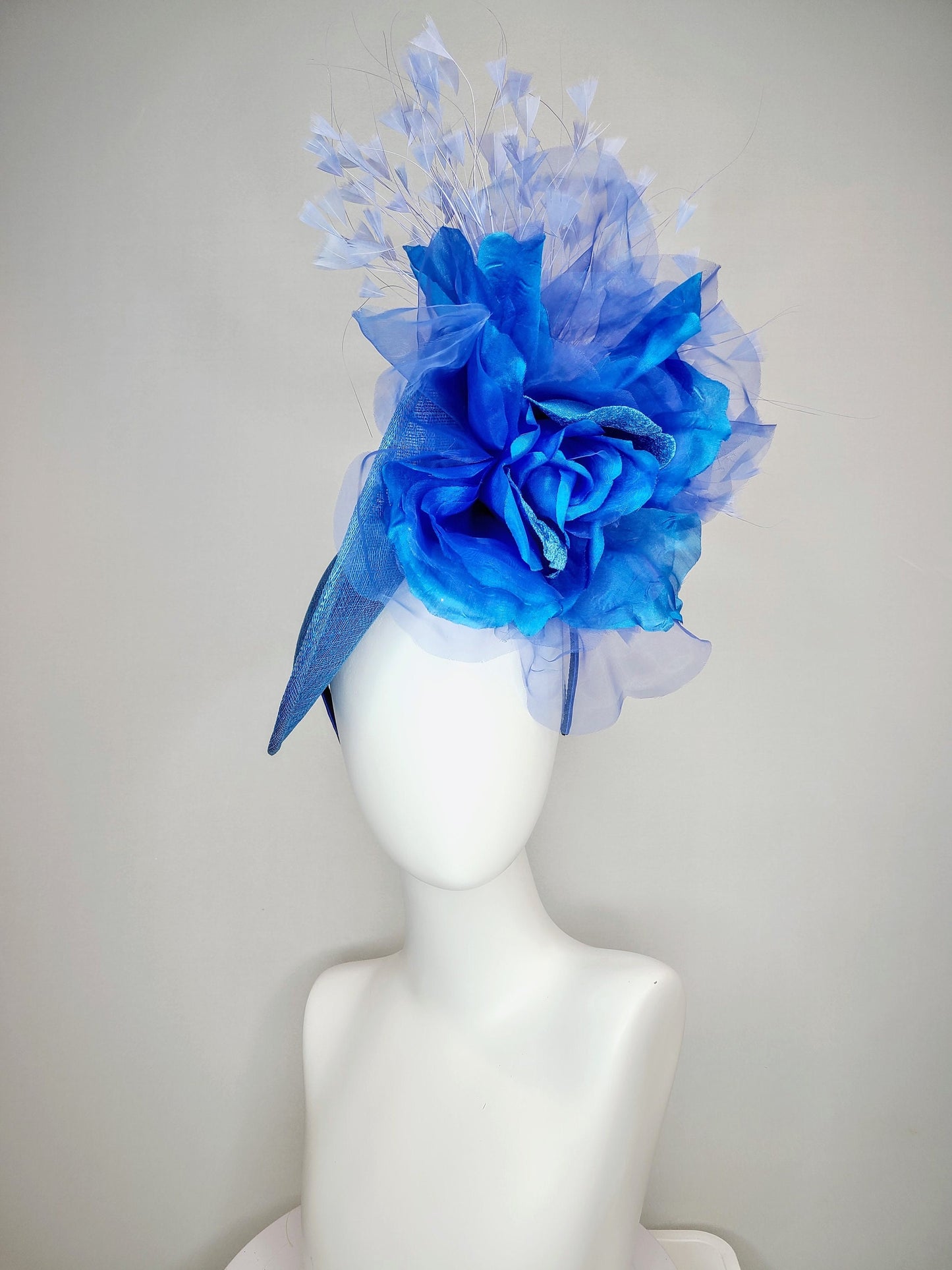 kentucky derby hat fascinator blue sinamay with royal blue large organza flower with periwinkle blue triangle feather spray