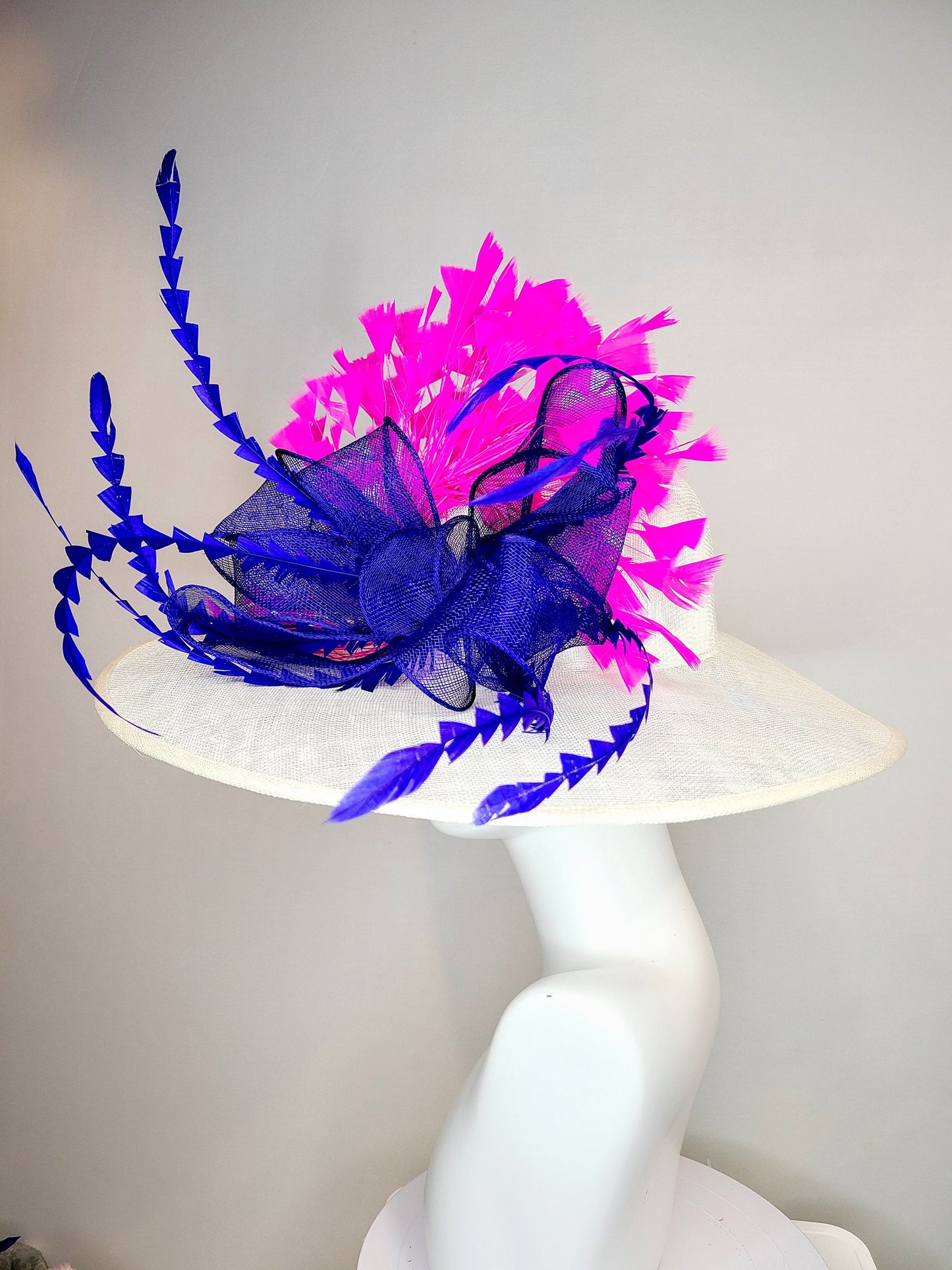 kentucky derby hat wide brim white sinamay with royal blue sinamay bow and hot pink fuchsia feathers