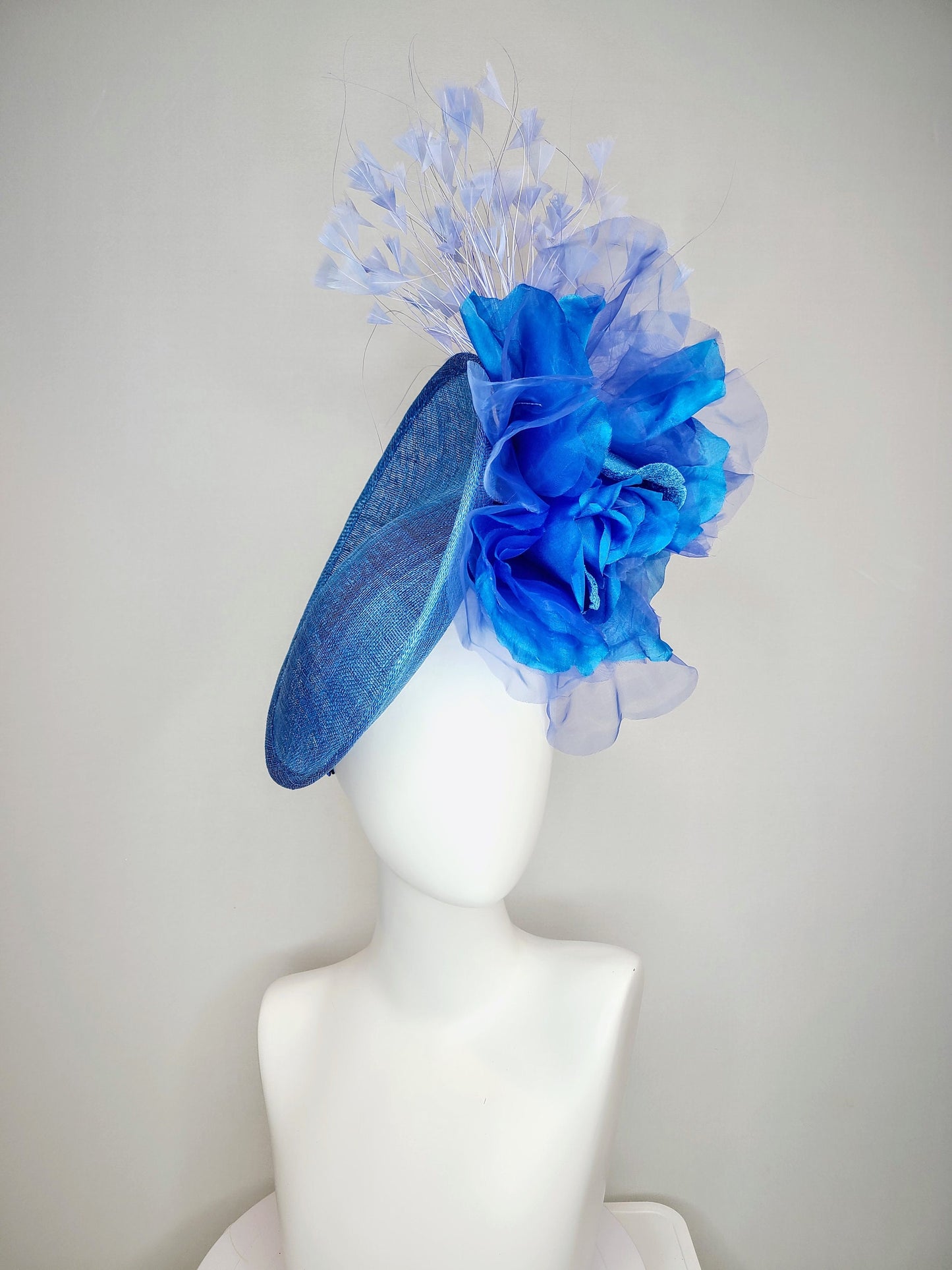 kentucky derby hat fascinator blue sinamay with royal blue large organza flower with periwinkle blue triangle feather spray