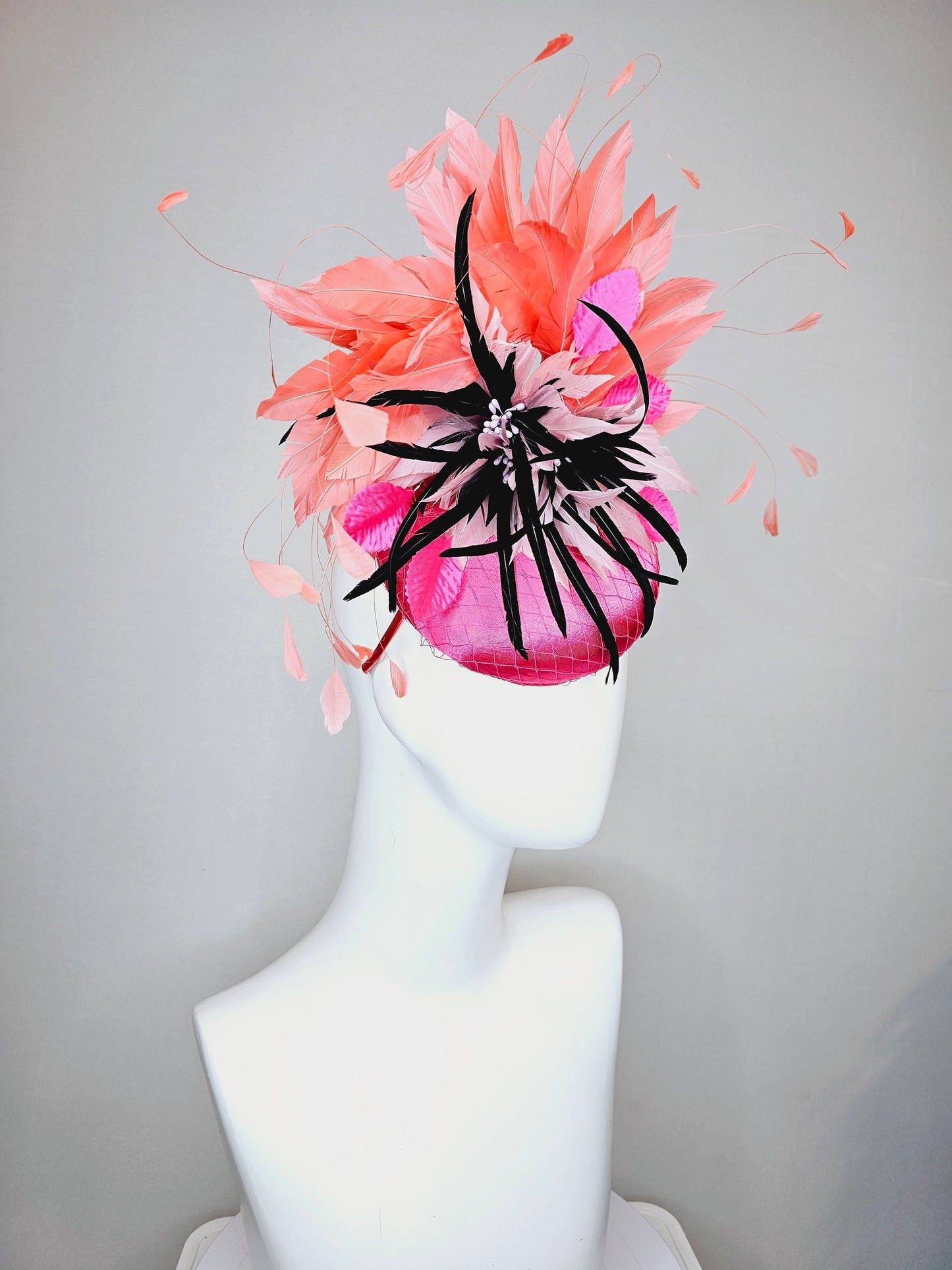 kentucky derby hat fascinator bright pink satin fascinator with light pink and black feather flower coral orange feathers