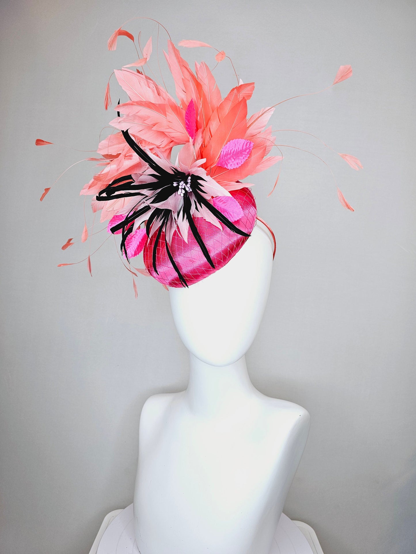 kentucky derby hat fascinator bright pink satin fascinator with light pink and black feather flower coral orange feathers