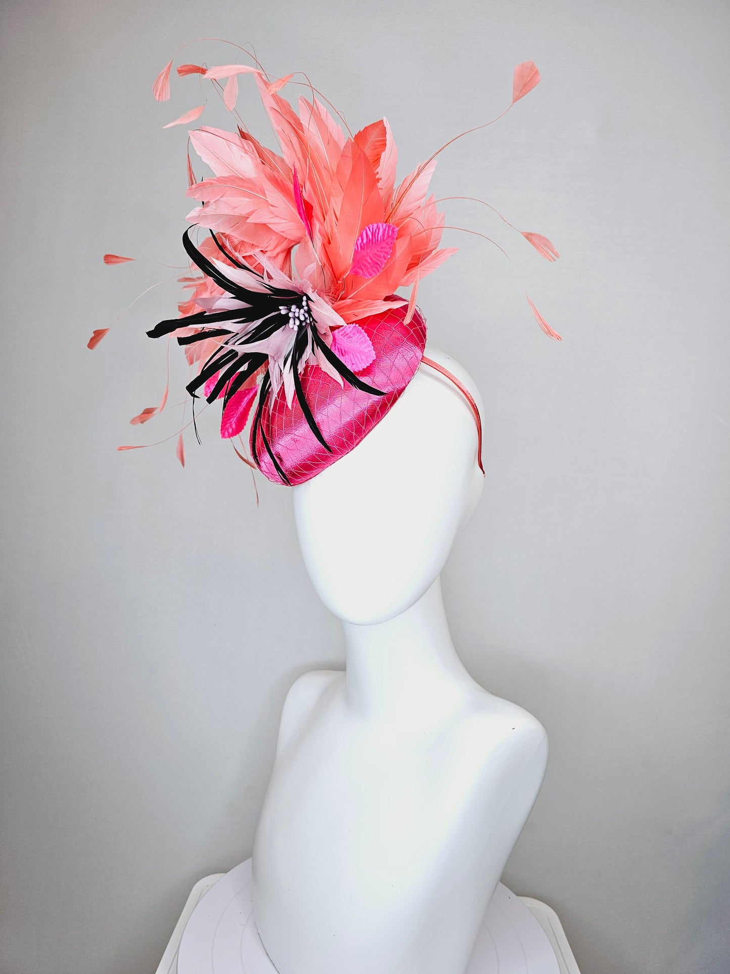 kentucky derby hat fascinator bright pink satin fascinator with light pink and black feather flower coral orange feathers