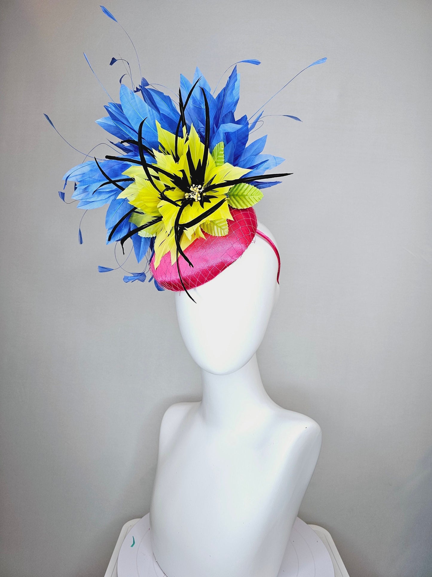 kentucky derby hat fascinator bright pink fuchsia satin with yellow and black feather flowers and periwinkle blue feathers