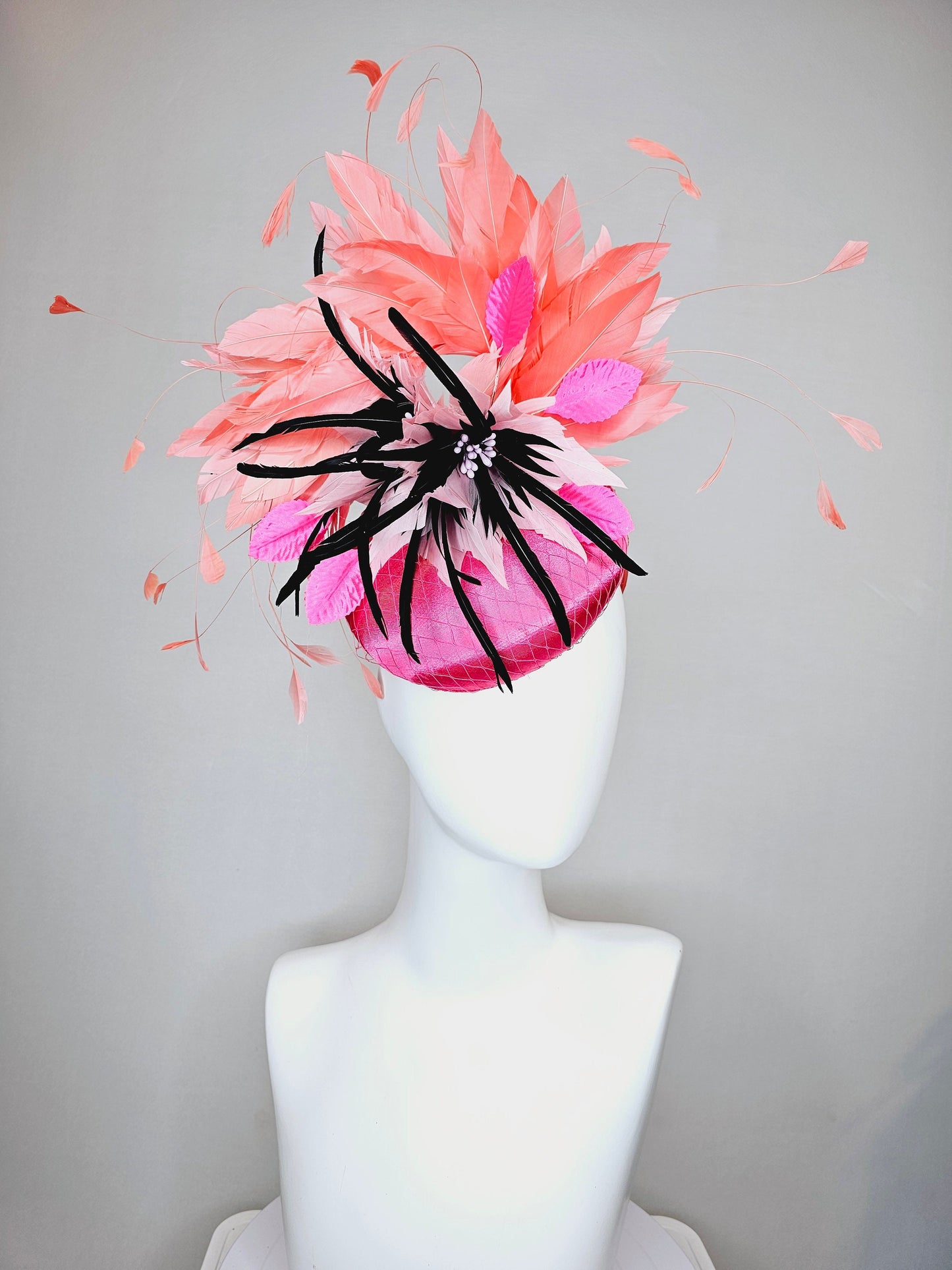 kentucky derby hat fascinator bright pink satin fascinator with light pink and black feather flower coral orange feathers