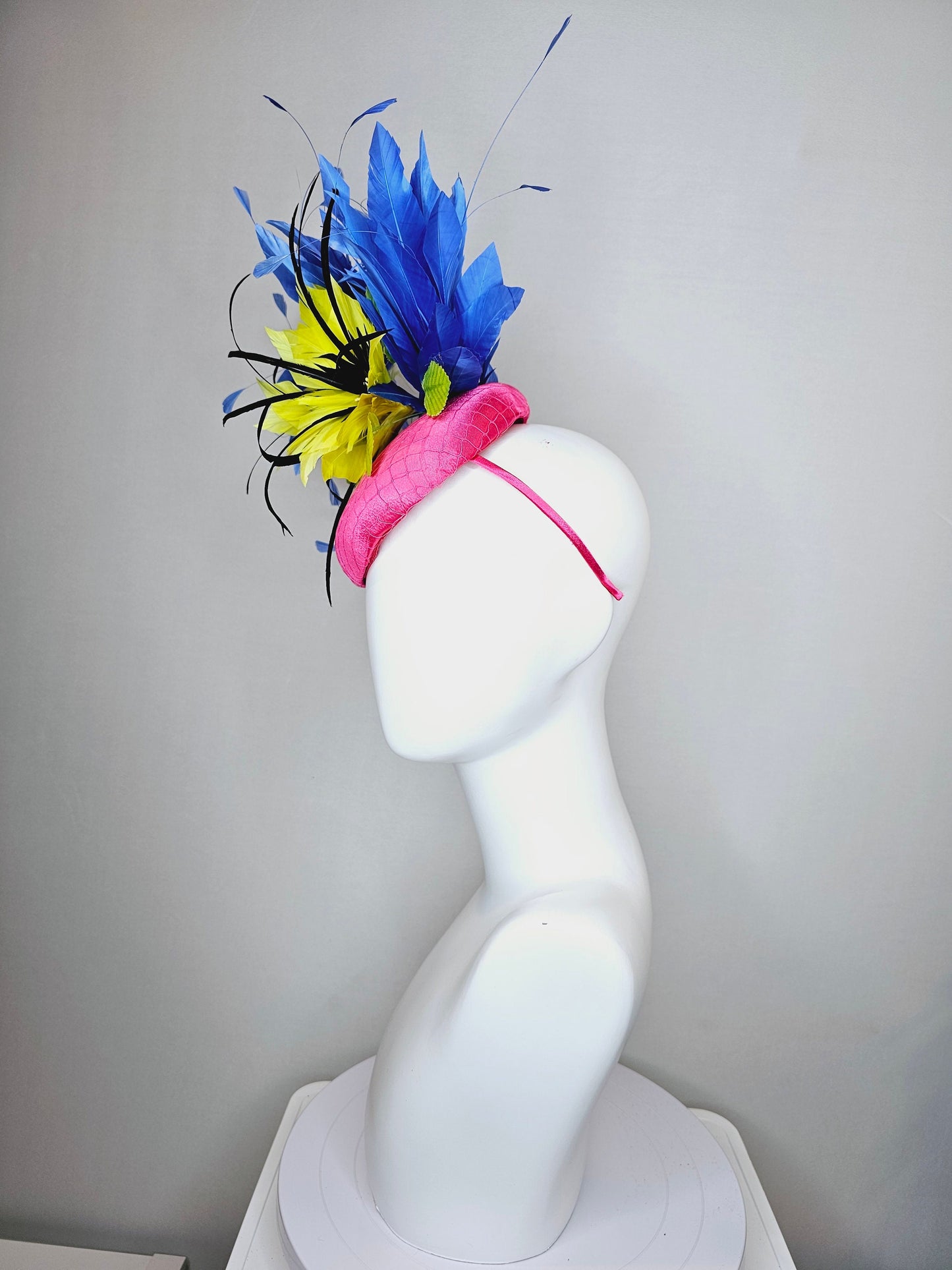 kentucky derby hat fascinator bright pink fuchsia satin with yellow and black feather flowers and periwinkle blue feathers