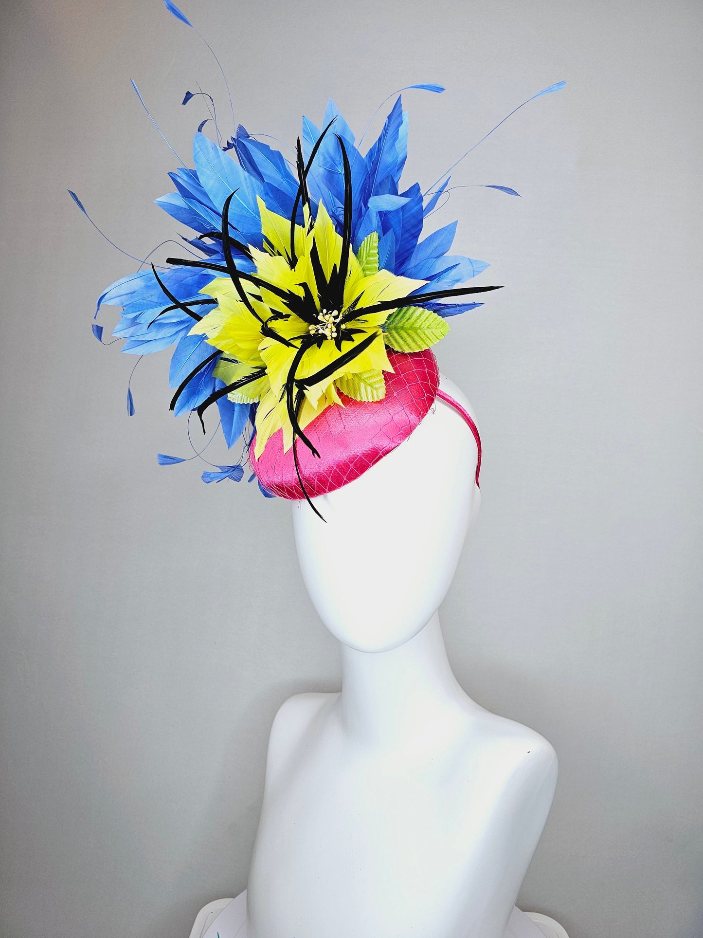 kentucky derby hat fascinator bright pink fuchsia satin with yellow and black feather flowers and periwinkle blue feathers