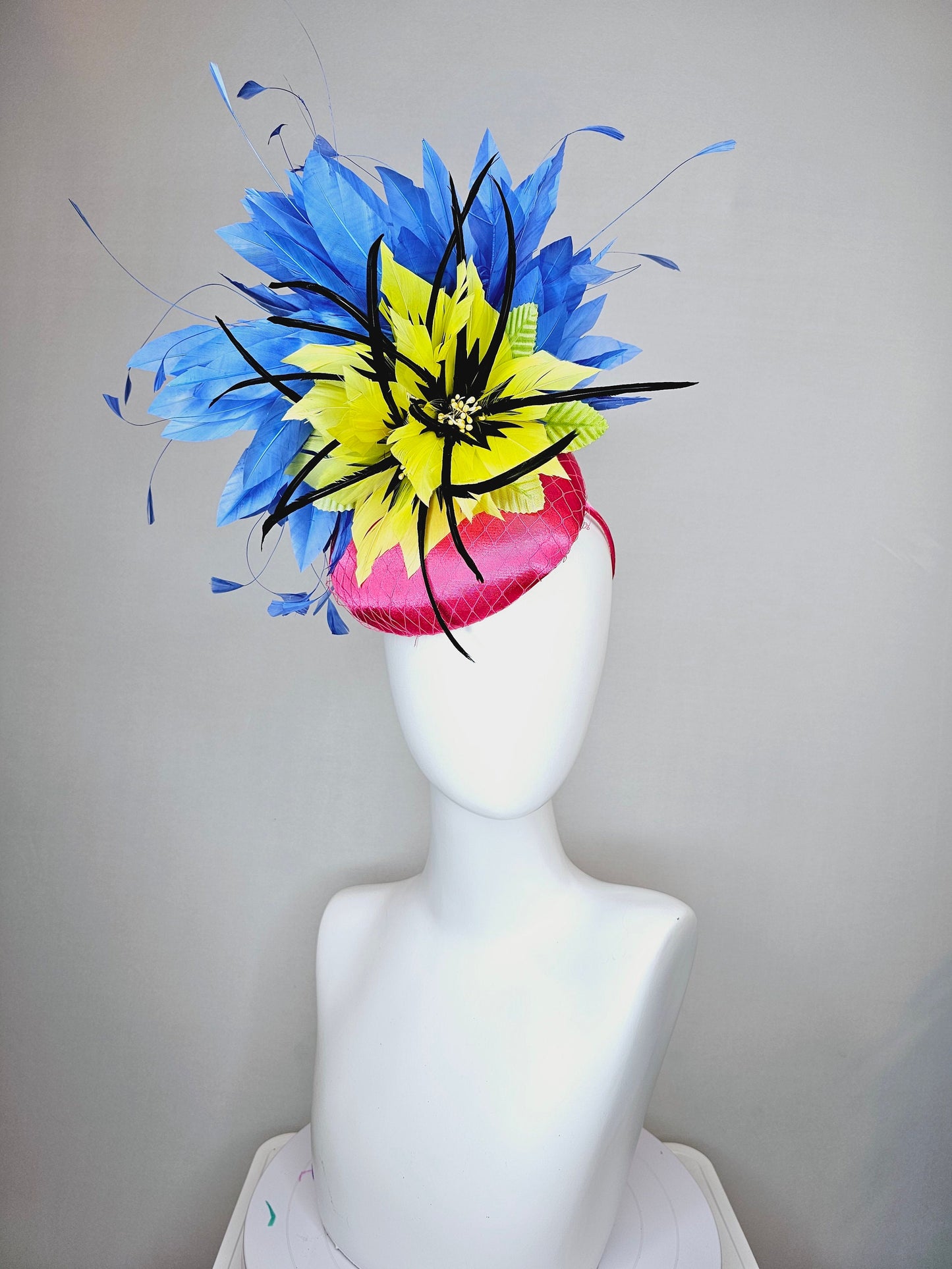 kentucky derby hat fascinator bright pink fuchsia satin with yellow and black feather flowers and periwinkle blue feathers