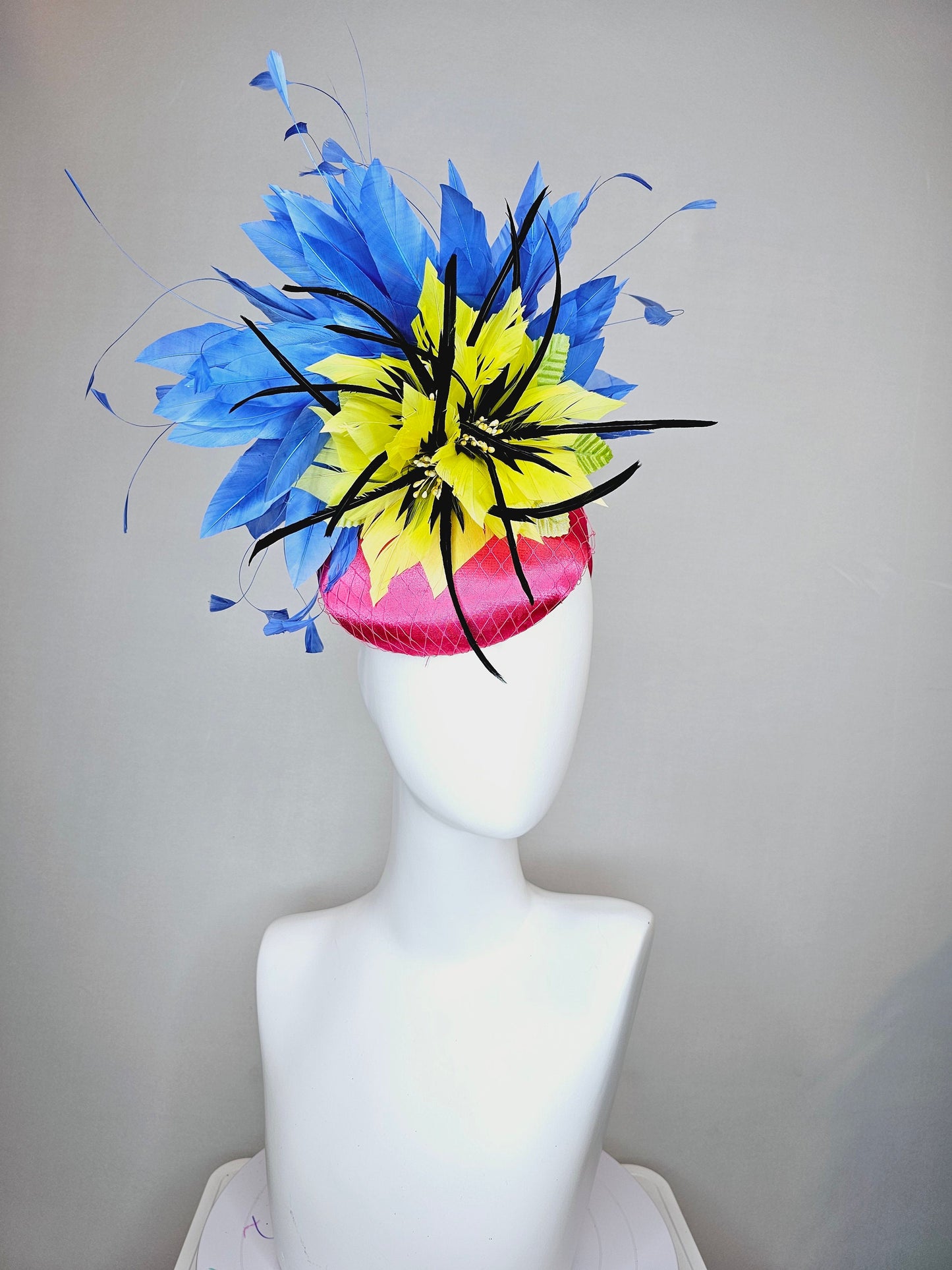 kentucky derby hat fascinator bright pink fuchsia satin with yellow and black feather flowers and periwinkle blue feathers