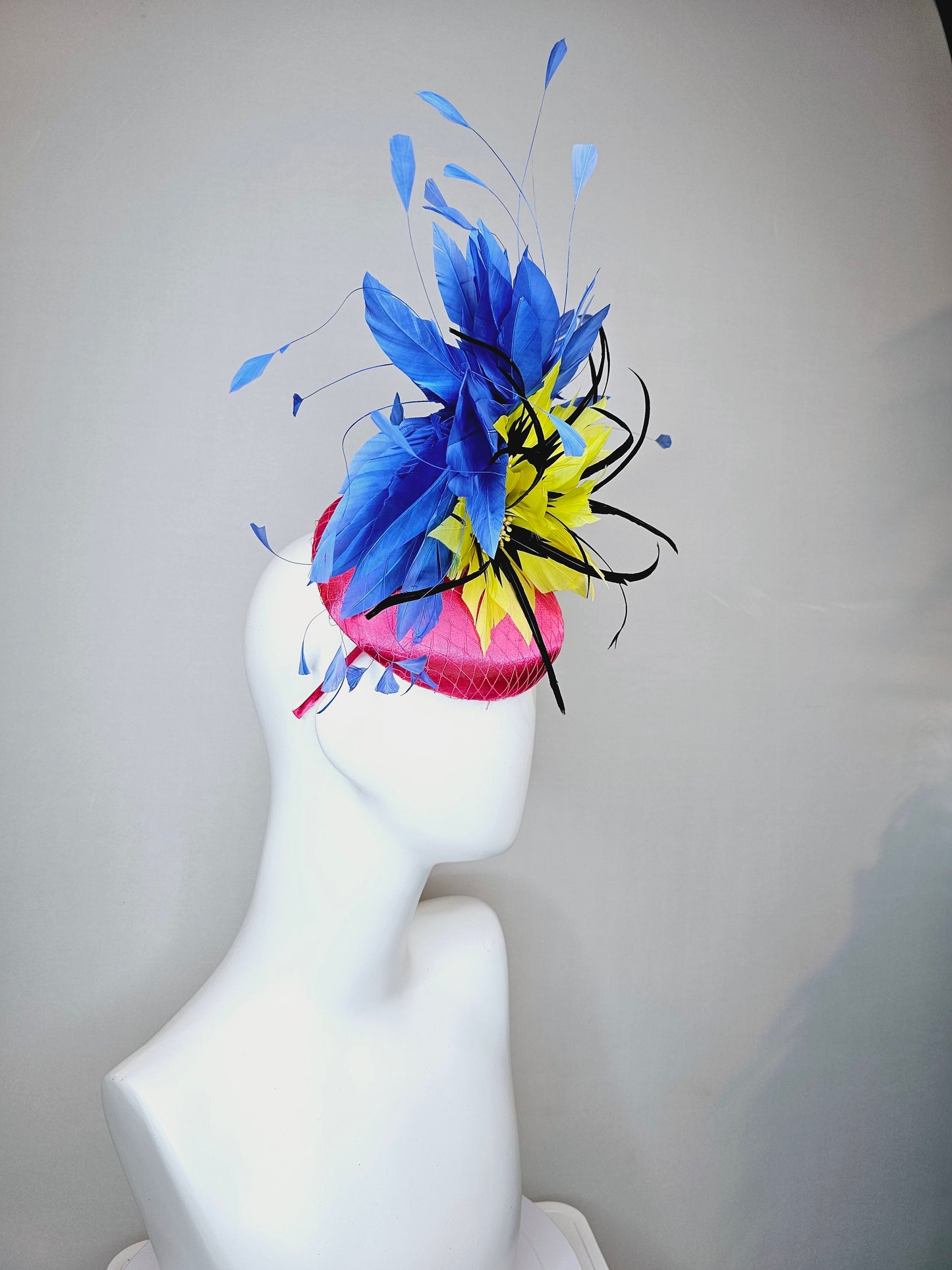 kentucky derby hat fascinator bright pink fuchsia satin with yellow and black feather flowers and periwinkle blue feathers