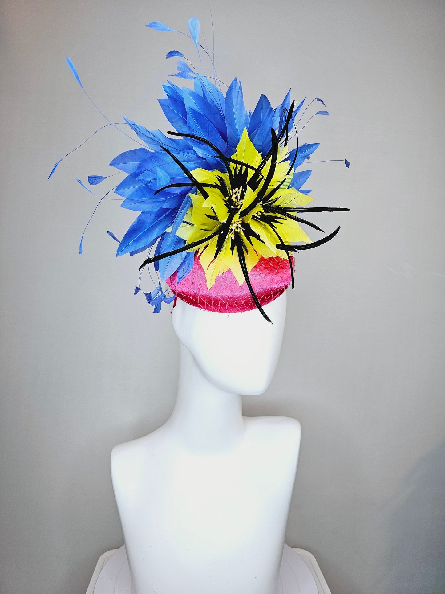 kentucky derby hat fascinator bright pink fuchsia satin with yellow and black feather flowers and periwinkle blue feathers