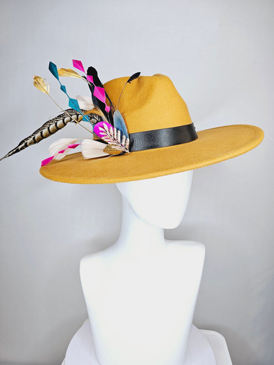 kentucky derby hat wide brim mustard gold  felt fedora rancher hat with colorful feather and stunning vegan leather and gold horsebit  decor